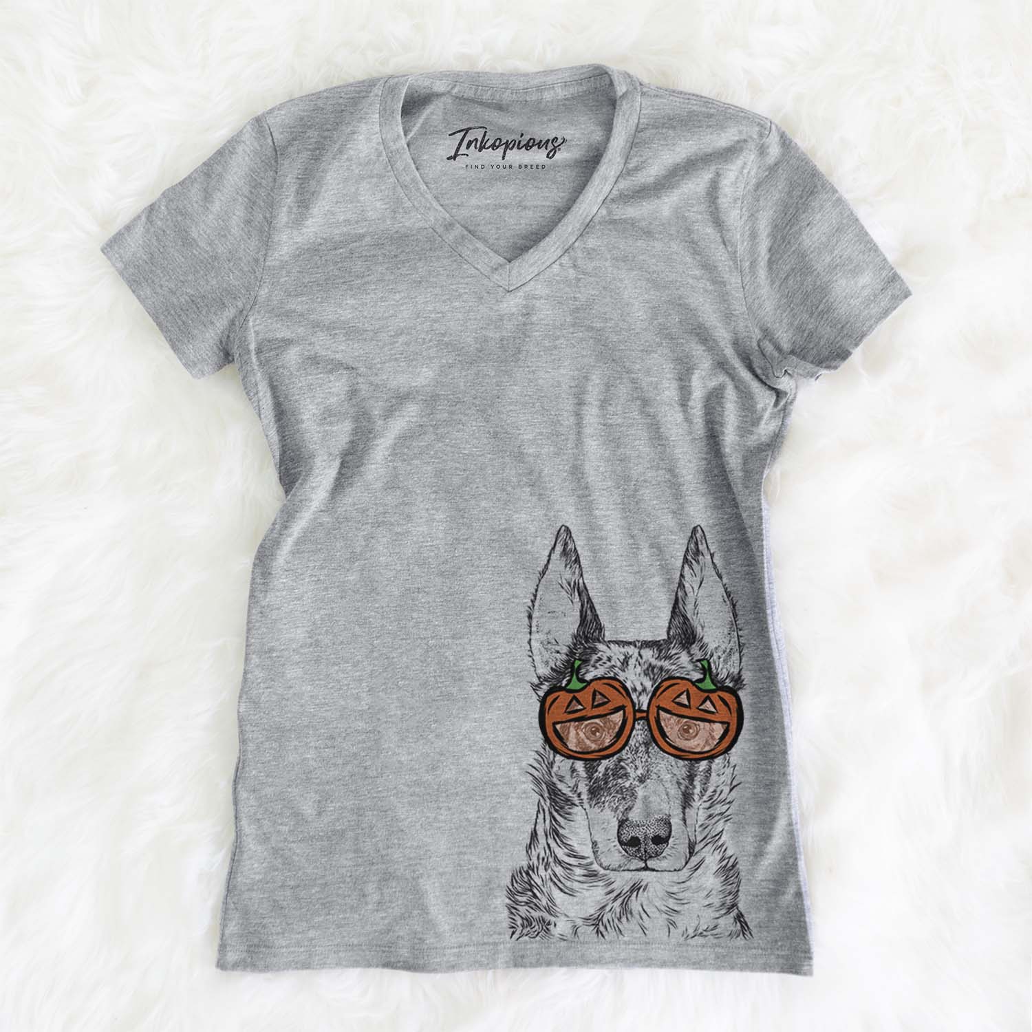 Hand-drawn sketch of Nori the Beauceron wearing pumpkin glasses on a Grey pumpkin collection, on a hanger