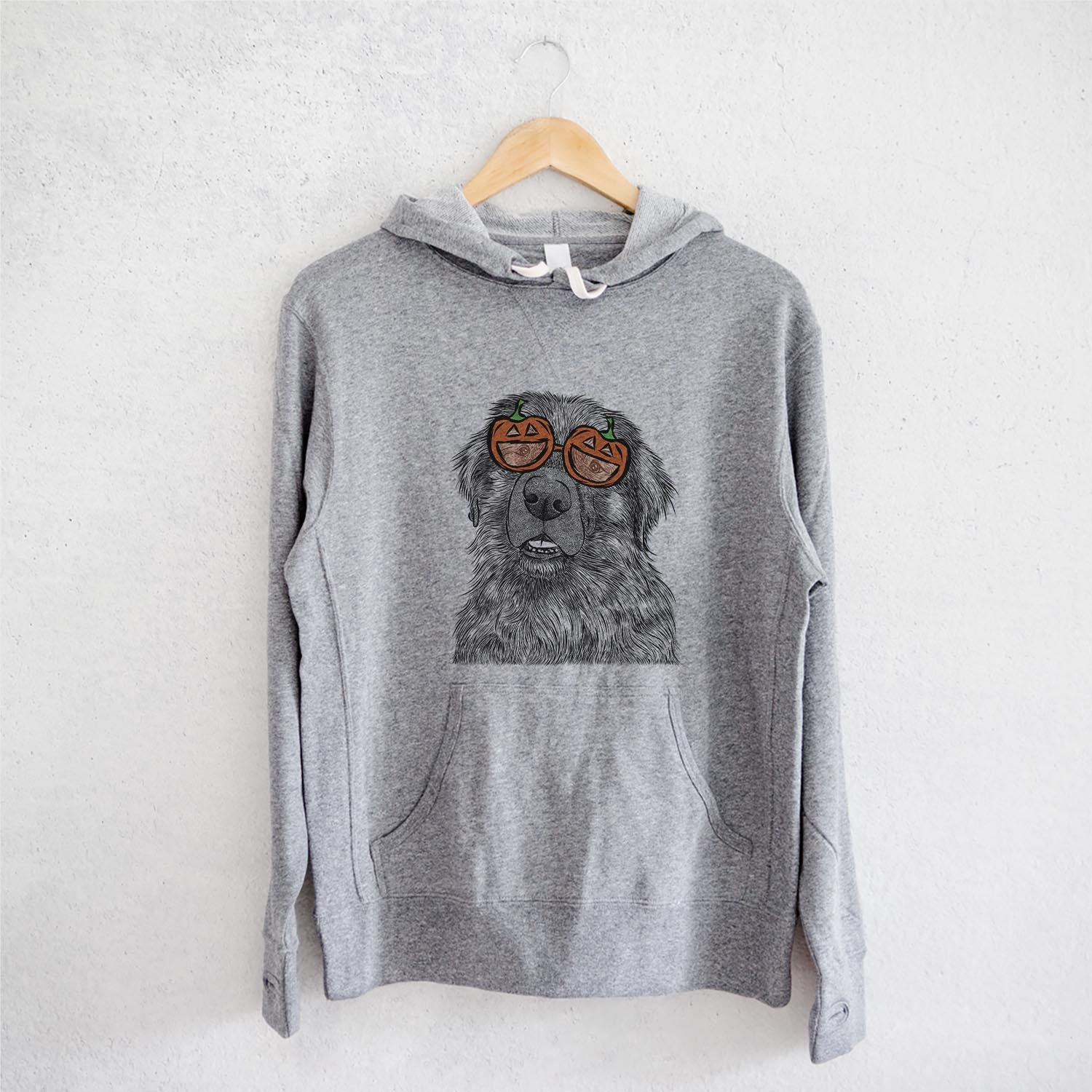 Hand-drawn sketch of Ralph the Leonberger wearing pumpkin glasses on a Grey pumpkin collection, on a hanger