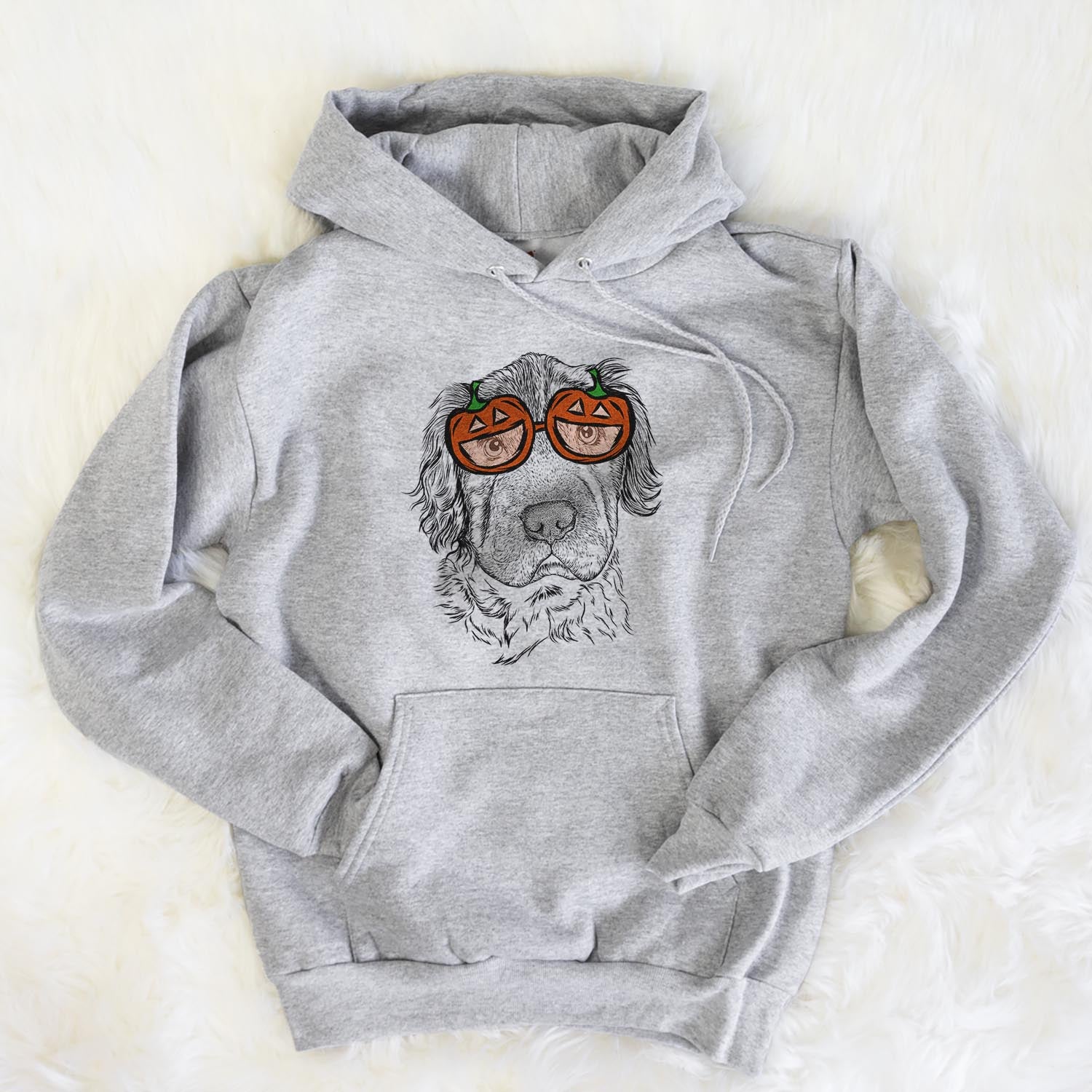 Hand-drawn sketch of Rex the Mini Hippo wearing pumpkin glasses on a Grey pumpkin collection, flat lay