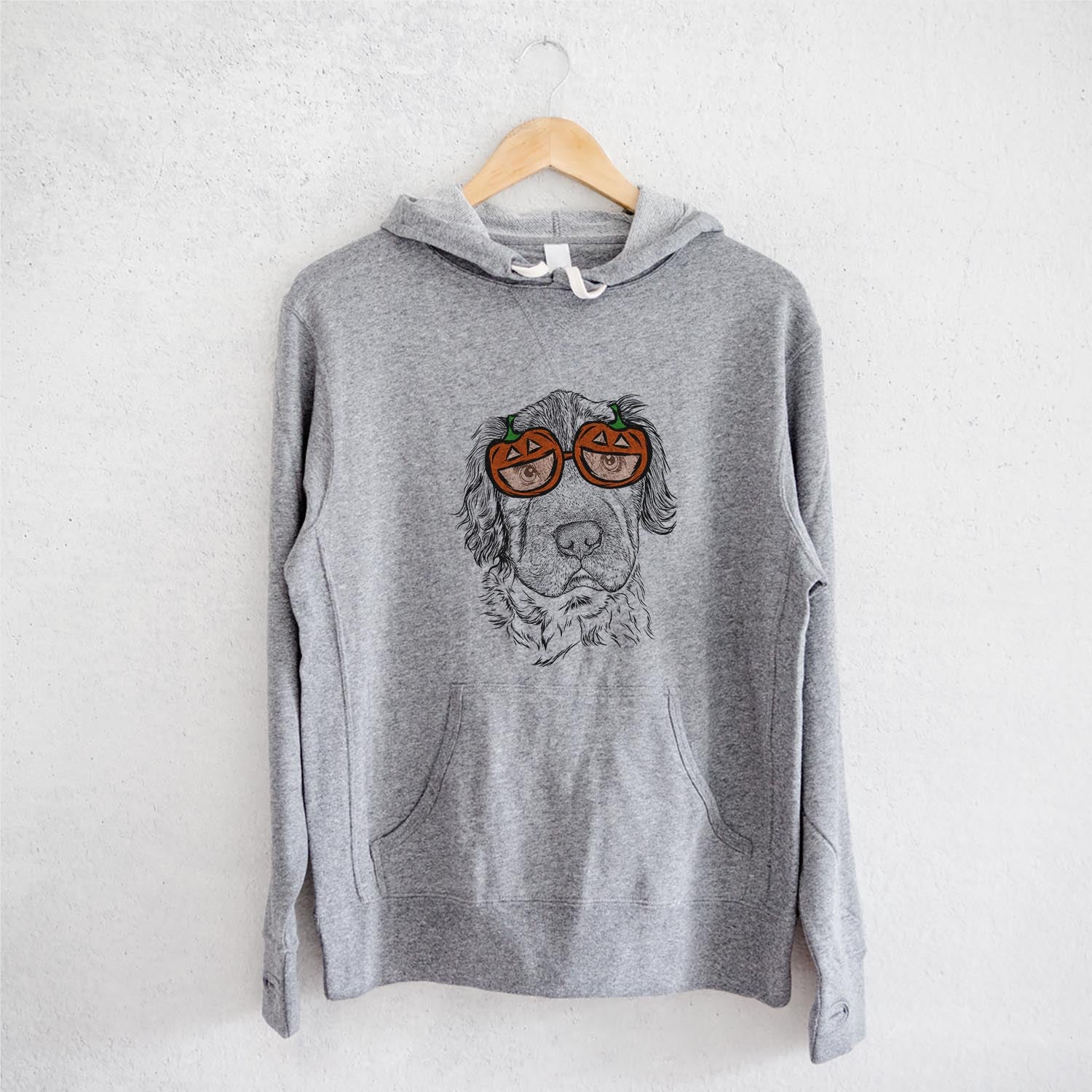 Hand-drawn sketch of Rex the Mini Hippo wearing pumpkin glasses on a Grey pumpkin collection, on a hanger