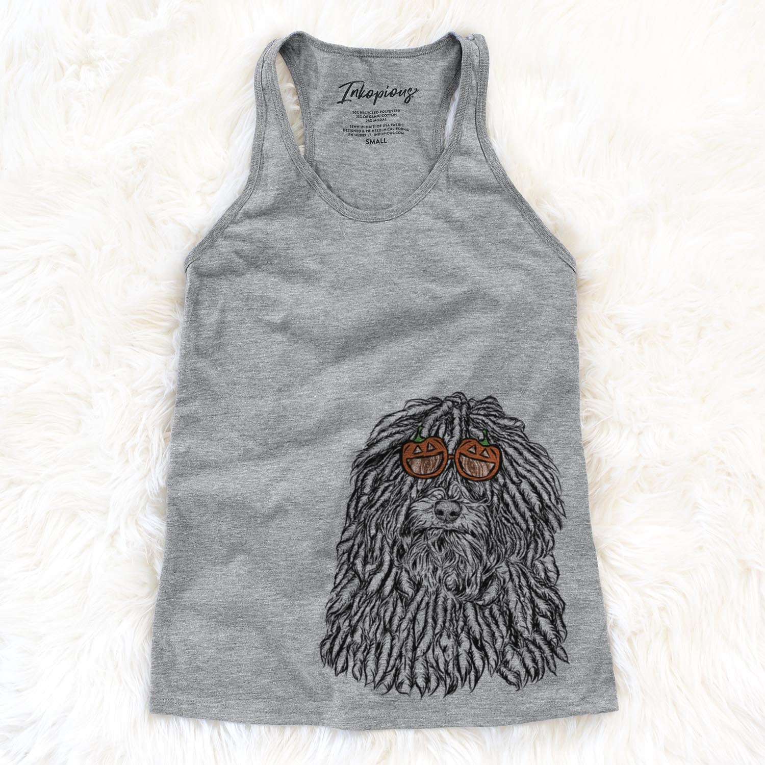 Hand-drawn sketch of Rezi the Puli wearing pumpkin glasses on a Grey pumpkin collection