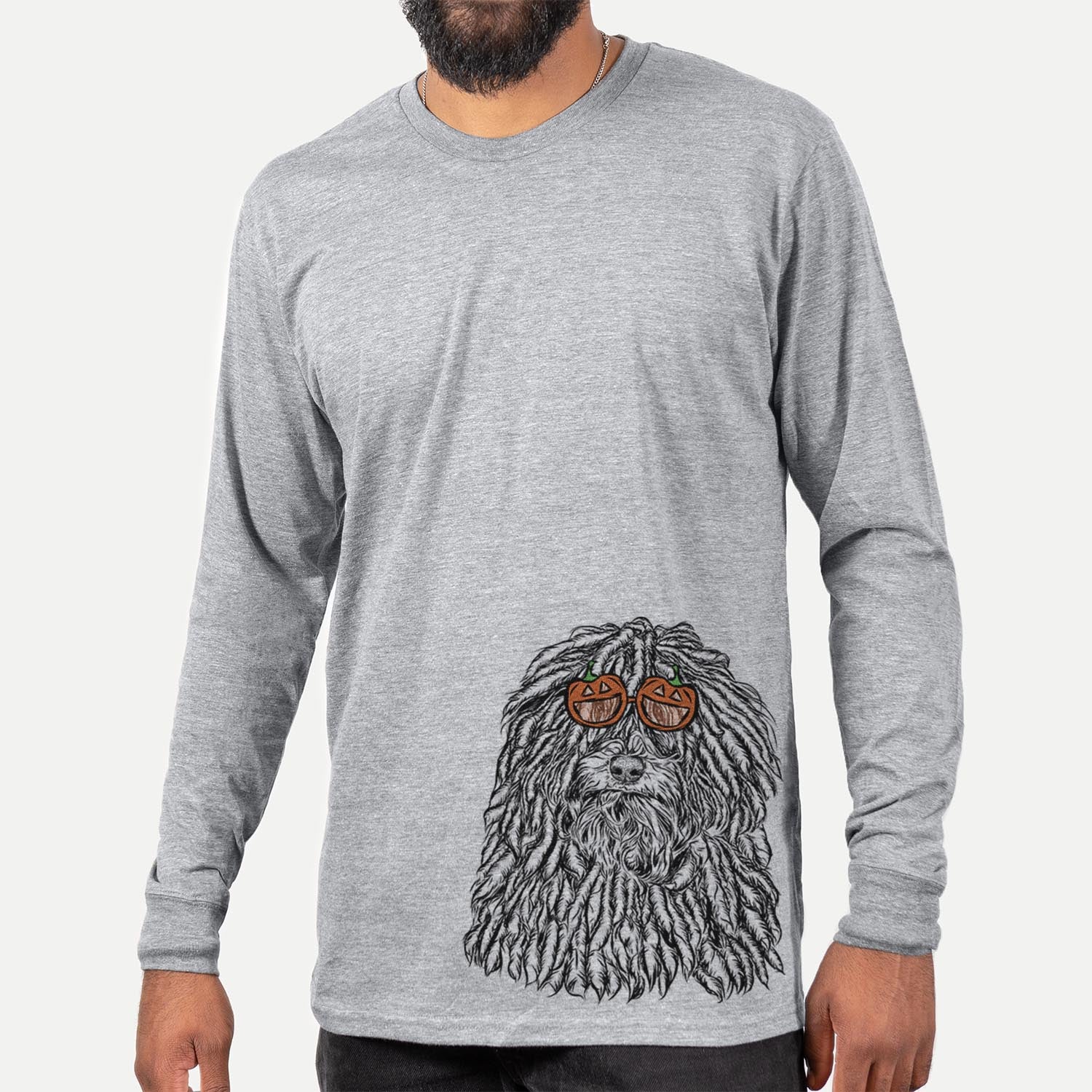 Hand-drawn sketch of Rezi the Puli wearing pumpkin glasses on a Grey pumpkin collection, hanging on a wall