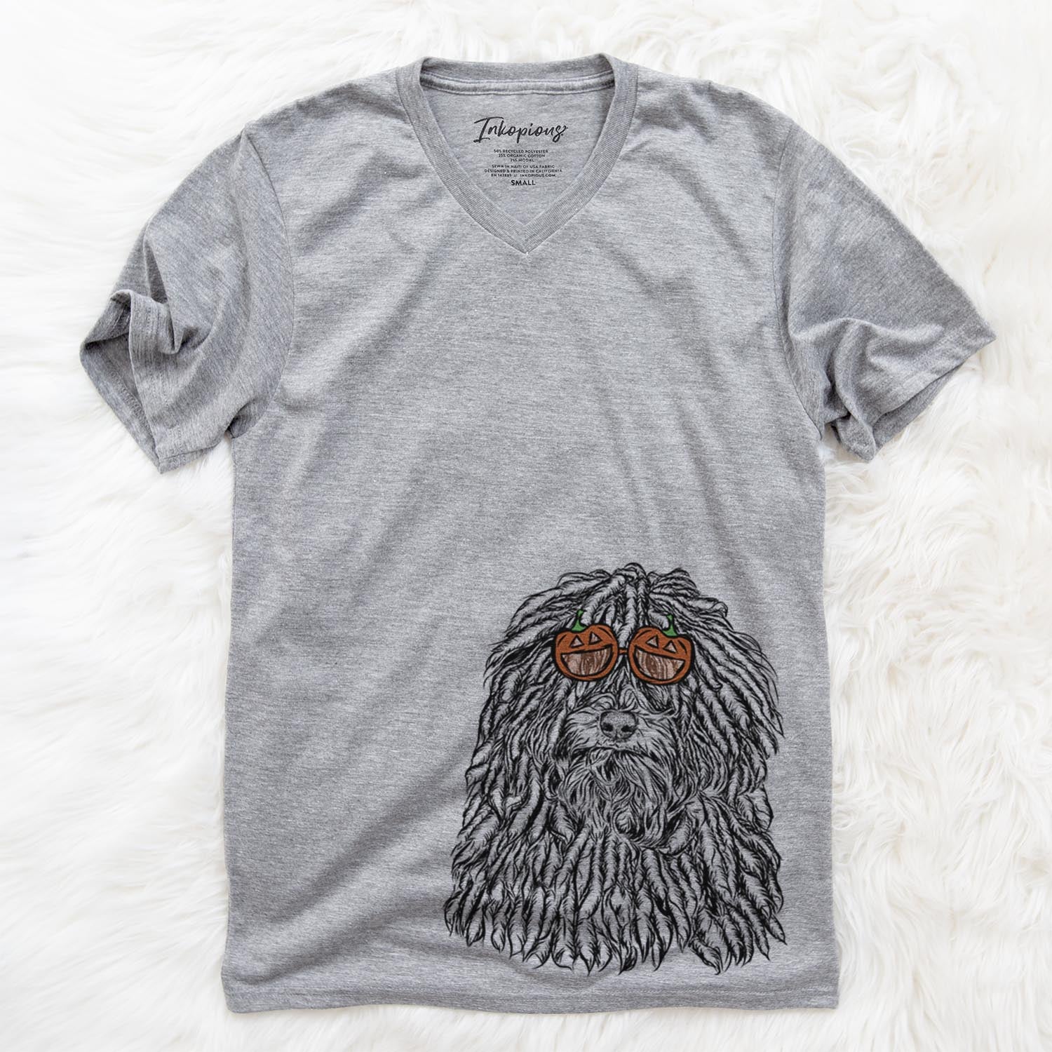 Hand-drawn sketch of Rezi the Puli wearing pumpkin glasses on a Grey pumpkin collection