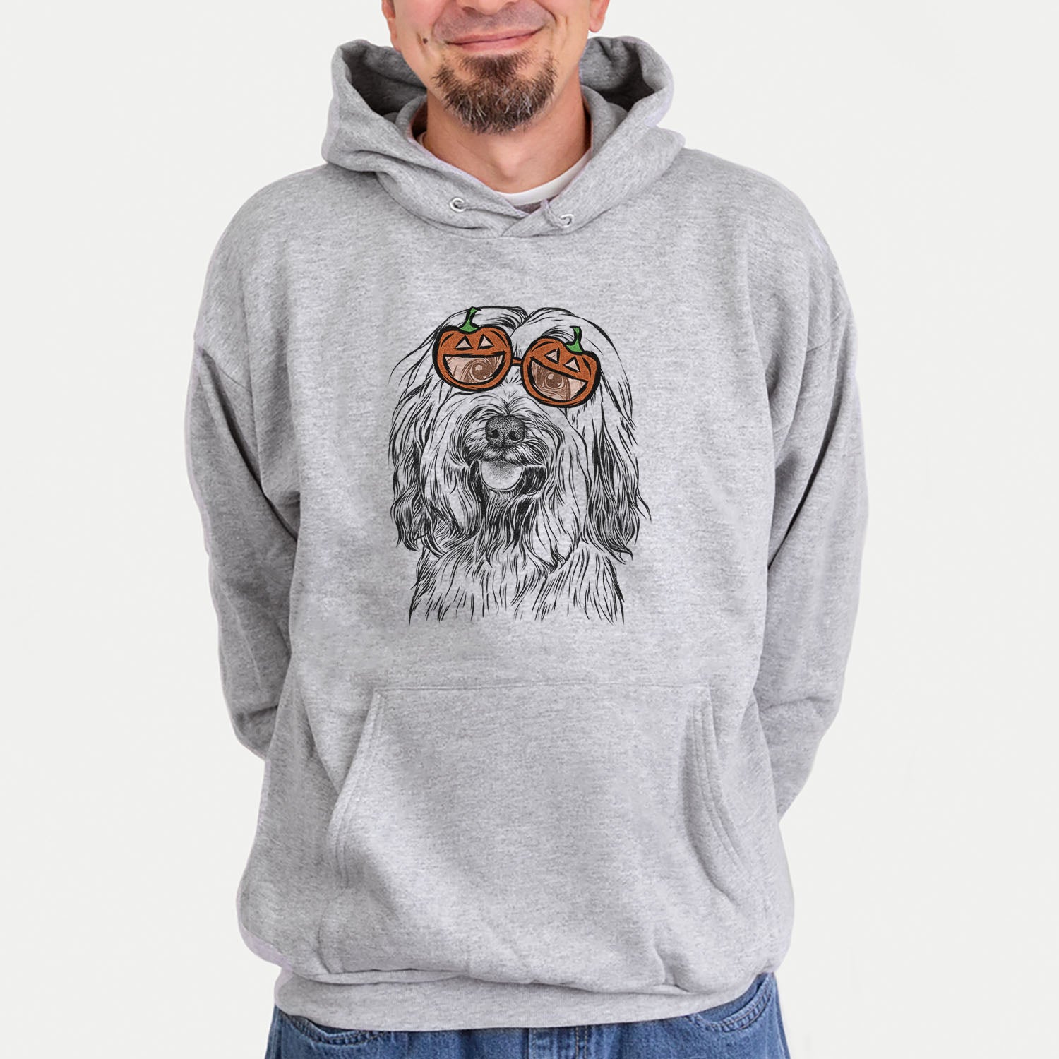 Hand-drawn sketch of Rime the Tibetan Terrier wearing pumpkin glasses on a Grey pumpkin collection, hanging on a wall