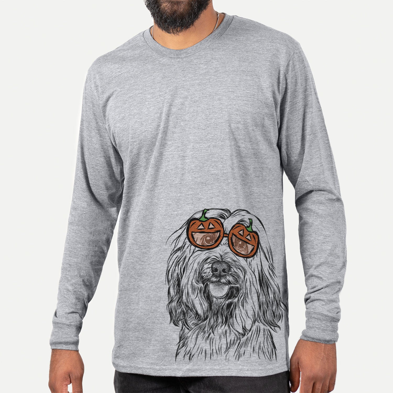 Hand-drawn sketch of Rime the Tibetan Terrier wearing pumpkin glasses on a Grey pumpkin collection, hanging on a wall