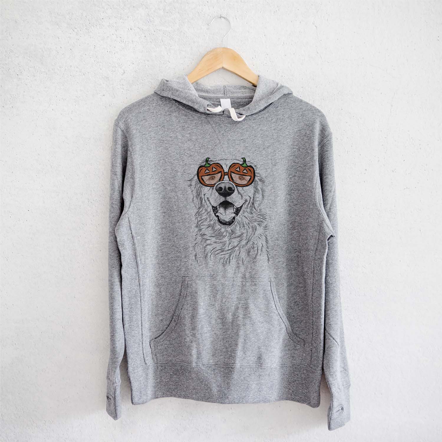 Hand-drawn sketch of Roger the Golden Retriever wearing pumpkin glasses on a Grey pumpkin collection, on a hanger