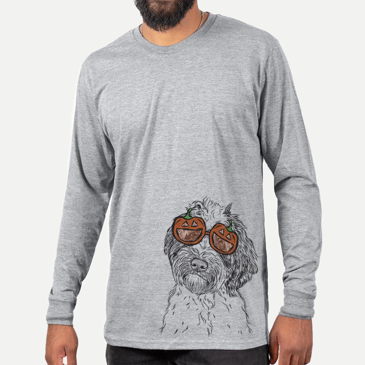 Hand-drawn sketch of Rooney the Aussiedoodle wearing pumpkin glasses on a Rooney Doodle pumpkin collection, hanging on a wall
