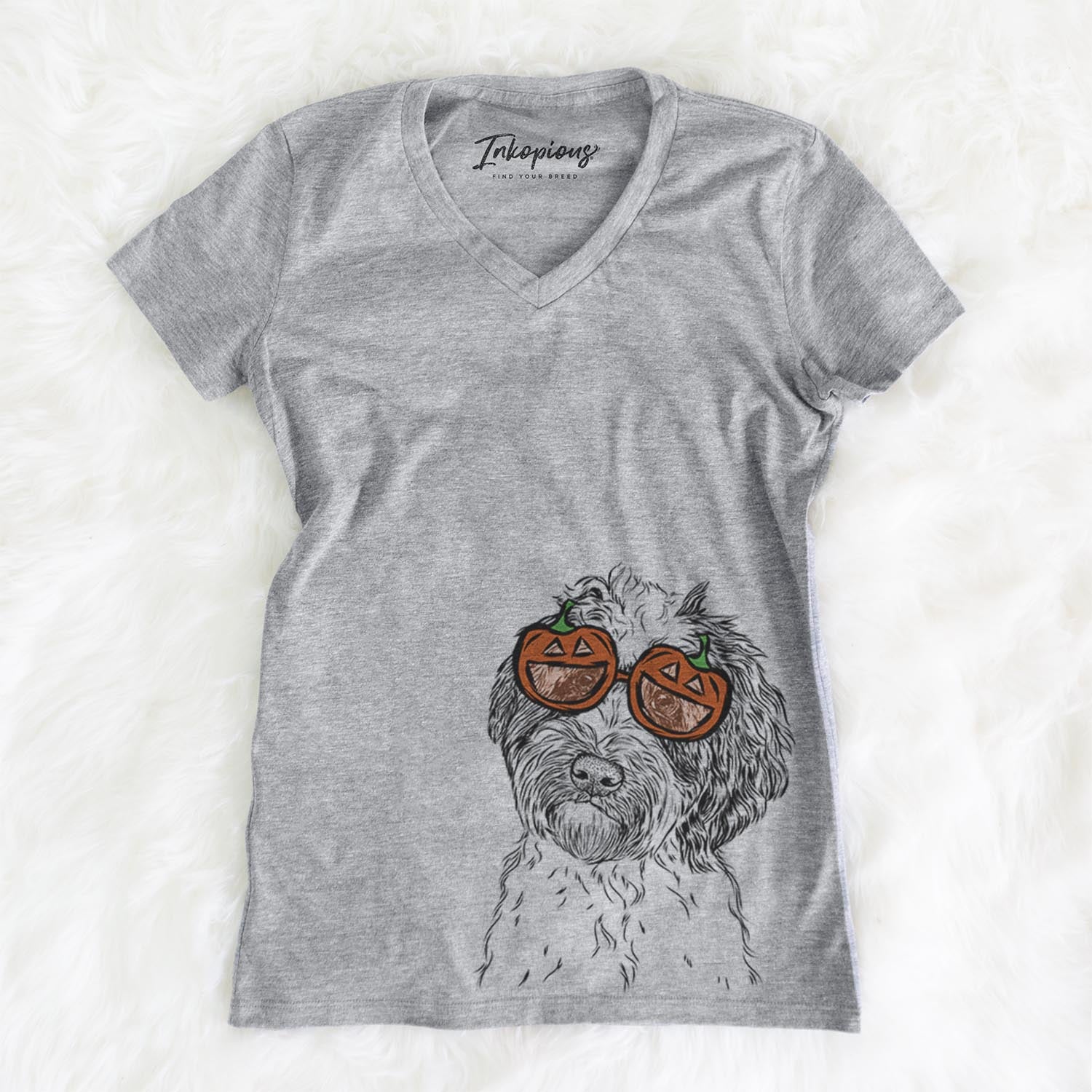 Hand-drawn sketch of Rooney the Aussiedoodle wearing pumpkin glasses on a Rooney Doodle pumpkin collection, on a hanger