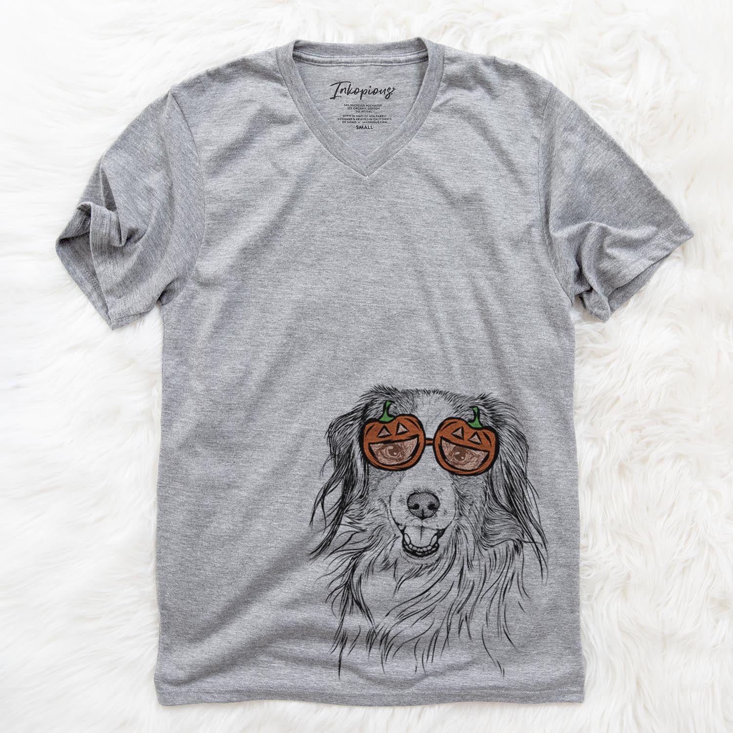 Hand-drawn sketch of Rutger the Nederlandse Kooikerhondje wearing pumpkin glasses on a Grey pumpkin collection