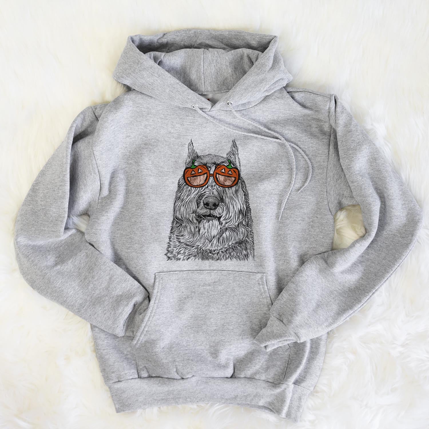 Hand-drawn sketch of Sabre the Bouvier des Flandres wearing pumpkin glasses on a Grey pumpkin collection, flat lay