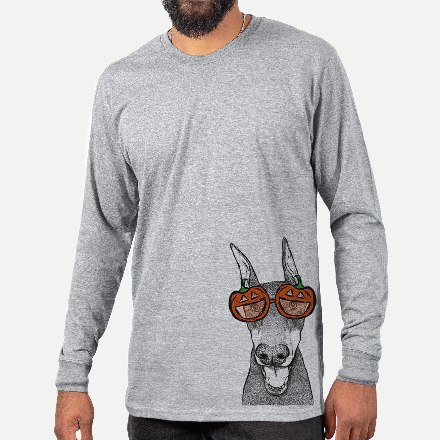 Hand-drawn sketch of Sir Duke the Doberman Pinscher wearing pumpkin glasses on a Grey pumpkin collection, hanging on a wall
