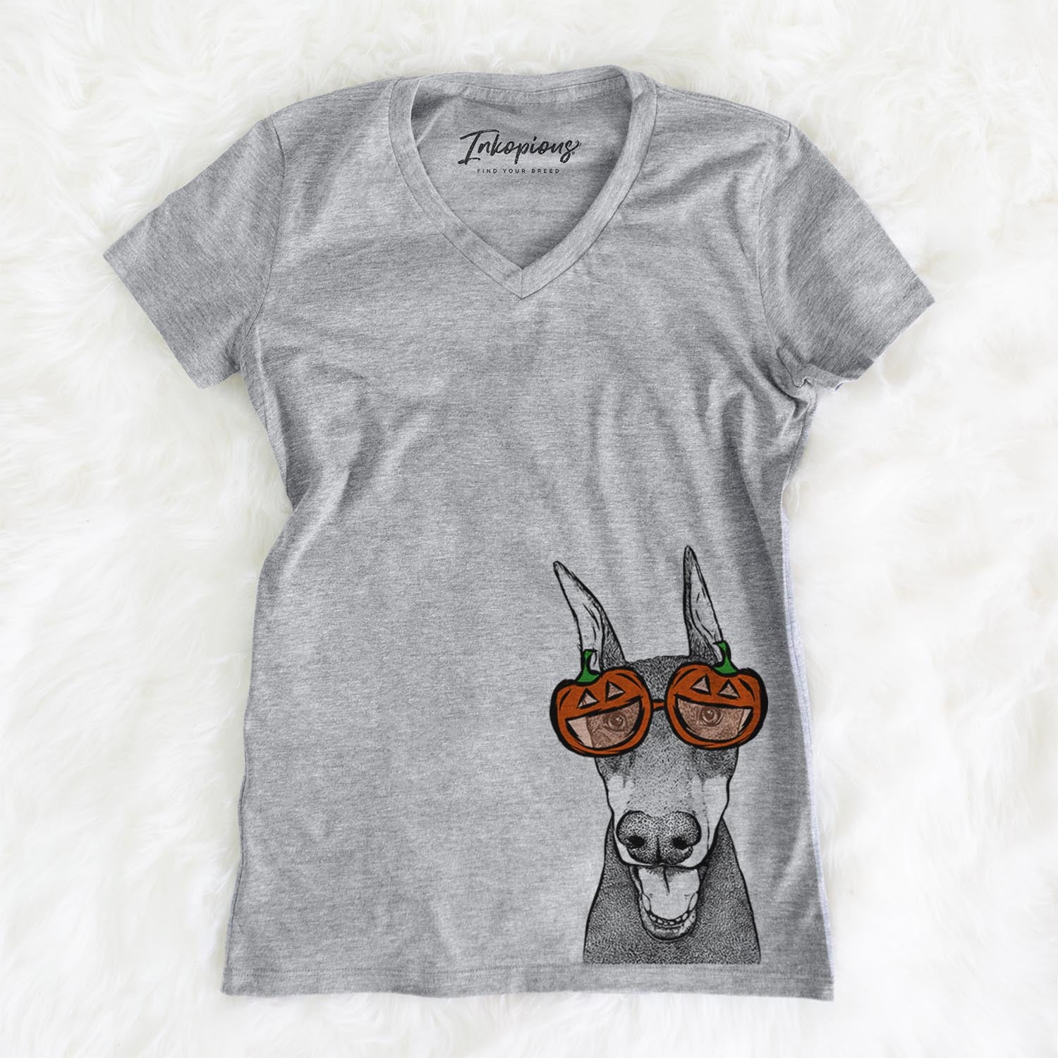 Hand-drawn sketch of Sir Duke the Doberman Pinscher wearing pumpkin glasses on a Grey pumpkin collection, on a hanger