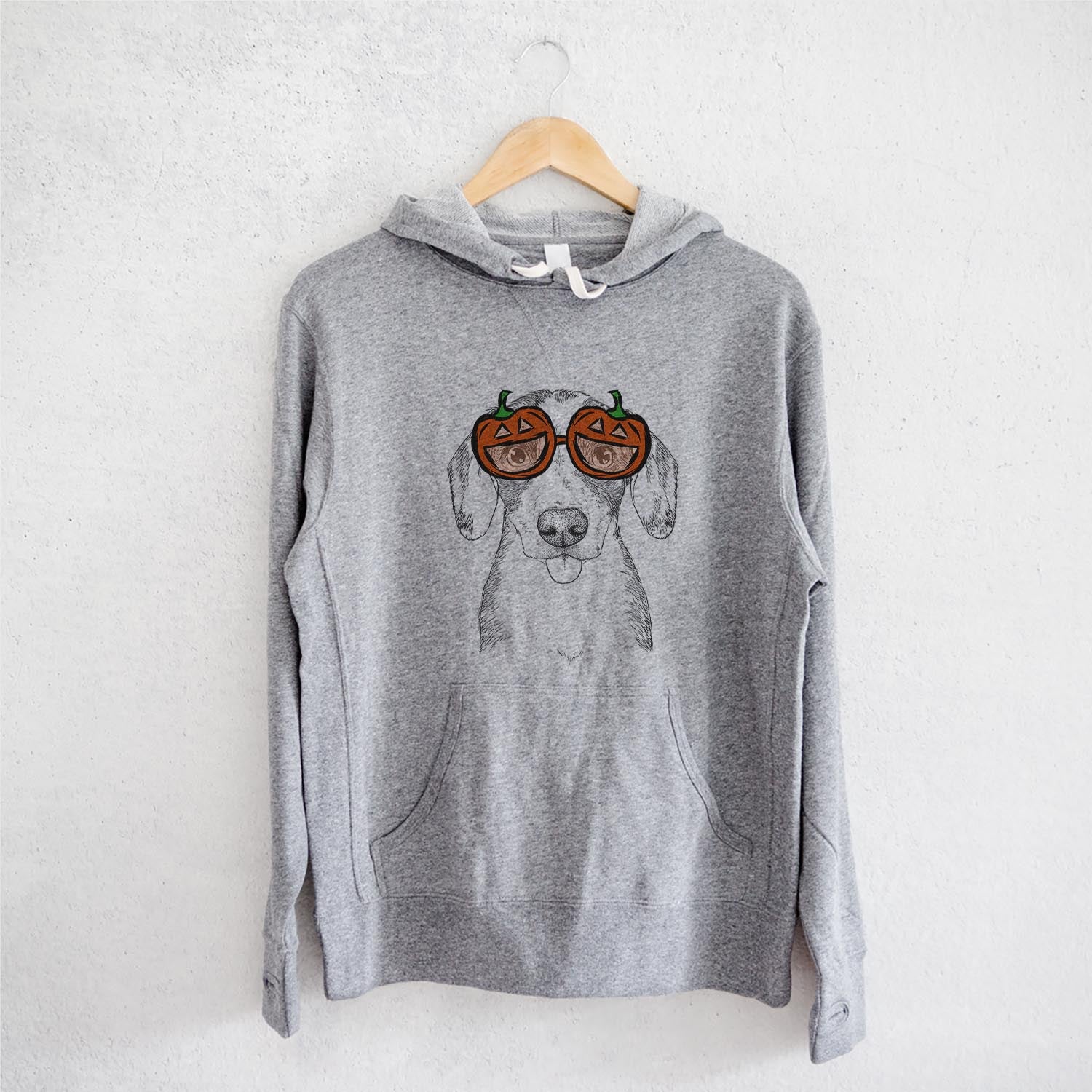 Hand-drawn sketch of SophiePea the Mixed Breed wearing pumpkin glasses on a Grey pumpkin collection, on a hanger
