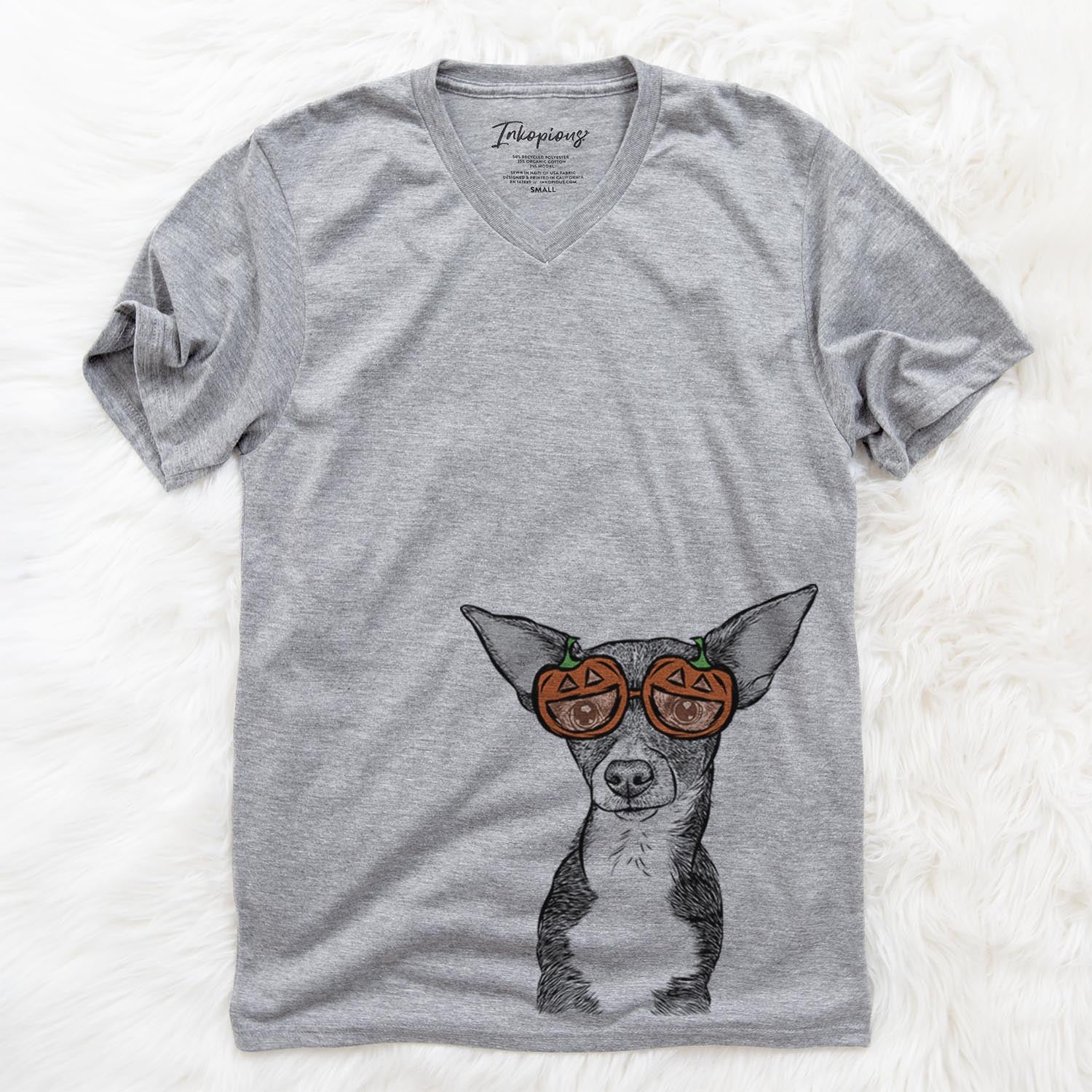 Hand-drawn sketch of Tiny Archie the Mixed Breed wearing pumpkin glasses on a Grey pumpkin collection