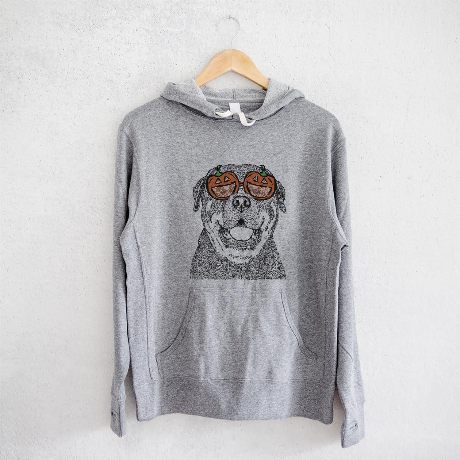Hand-drawn sketch of Titan the Rottweiler wearing pumpkin glasses on a Grey pumpkin collection, on a hanger