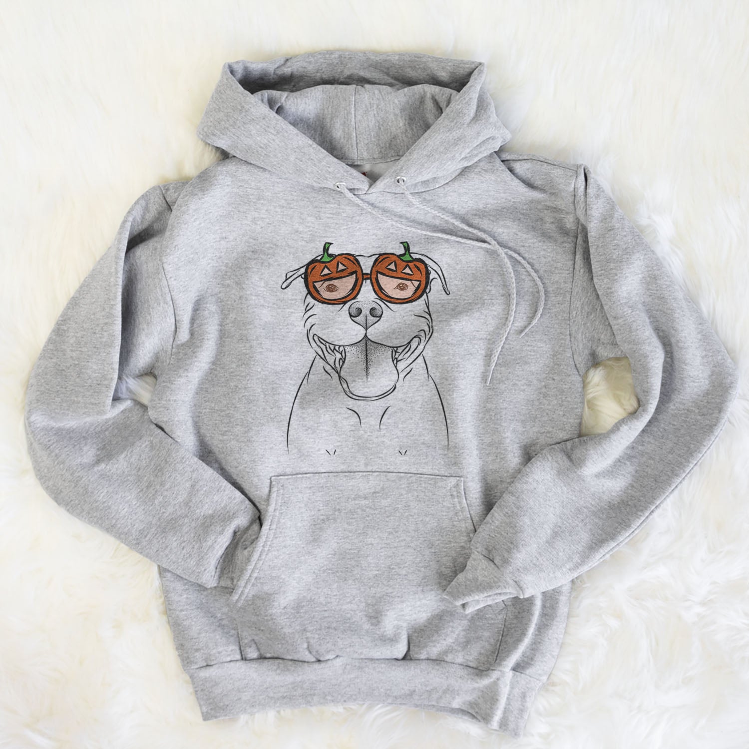 Hand-drawn sketch of Wafer the Staffordshire Bull Terrier wearing pumpkin glasses on a Grey pumpkin collection, flat lay