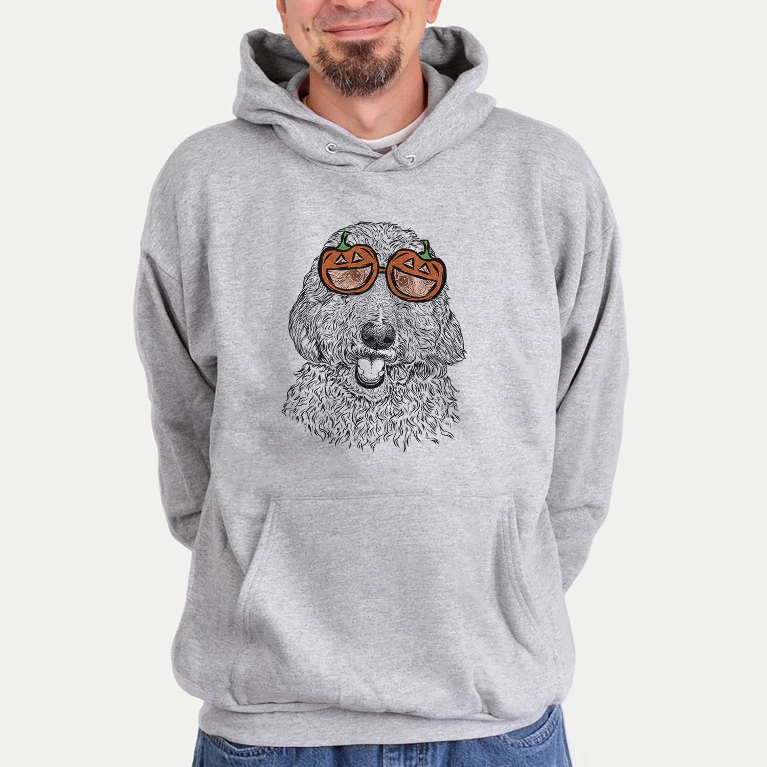 Hand-drawn sketch of Whisper the Goldendoodle wearing pumpkin glasses on a Grey pumpkin collection, hanging on a wall
