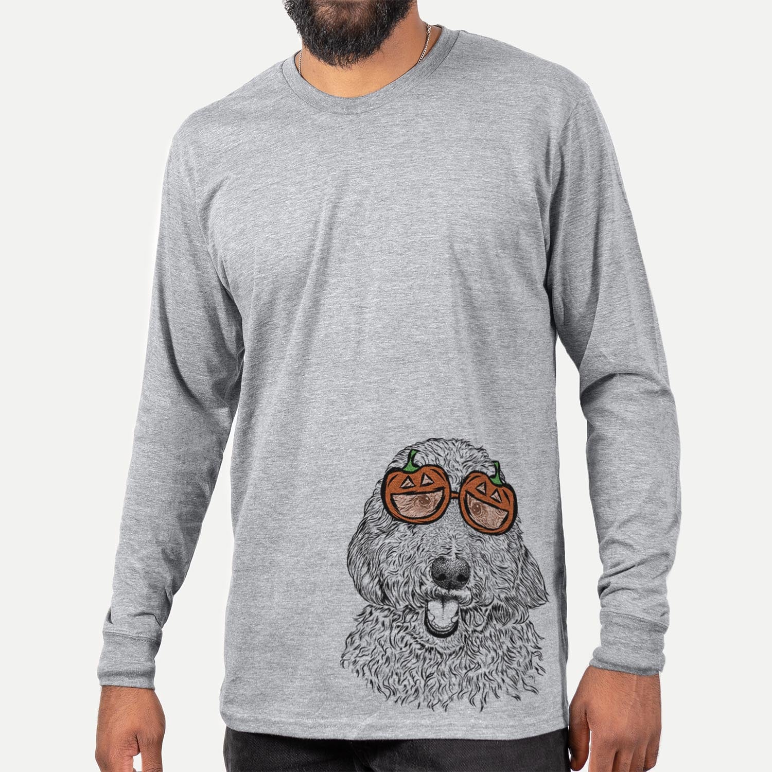 Hand-drawn sketch of Whisper the Goldendoodle wearing pumpkin glasses on a Grey pumpkin collection, hanging on a wall