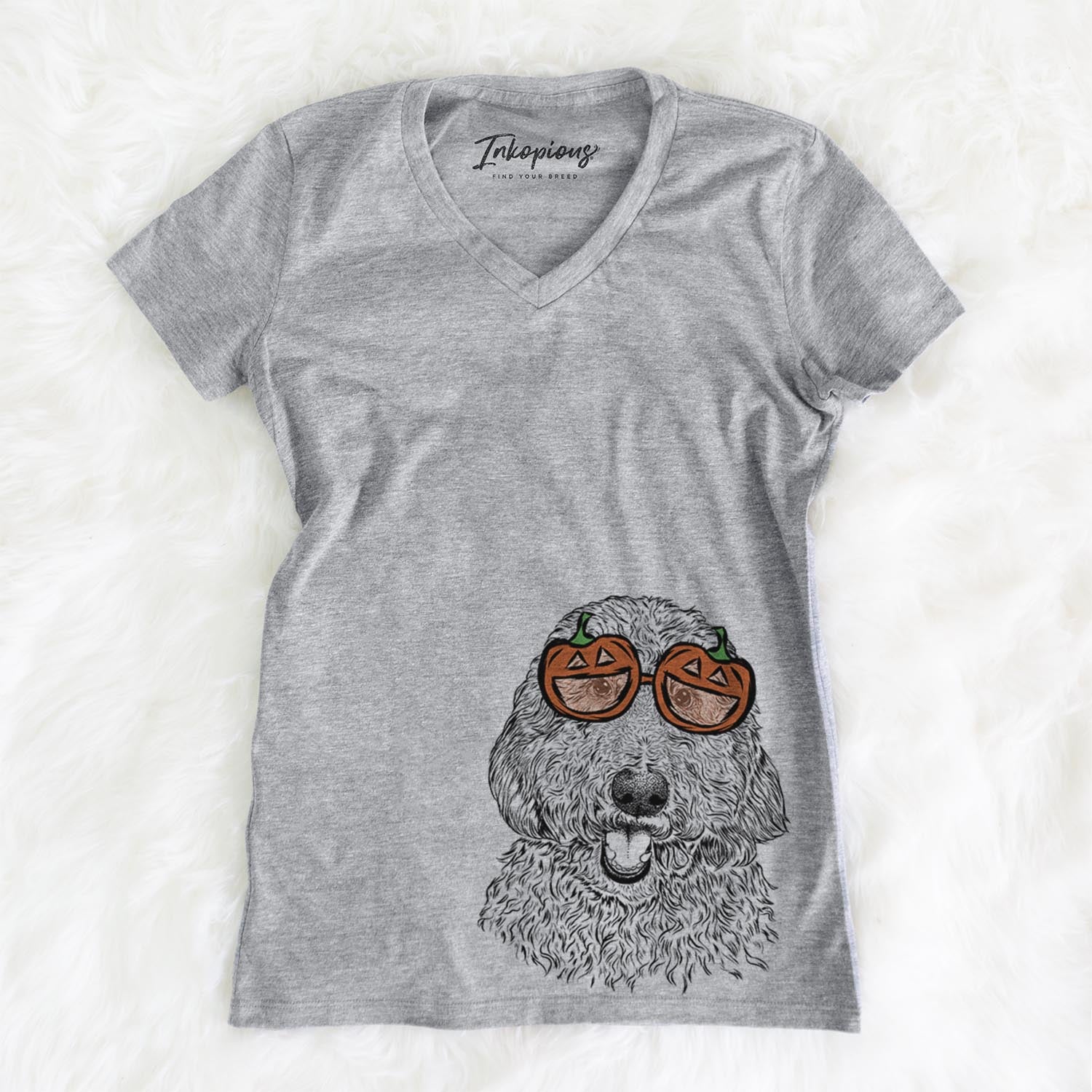 Hand-drawn sketch of Whisper the Goldendoodle wearing pumpkin glasses on a Grey pumpkin collection, on a hanger