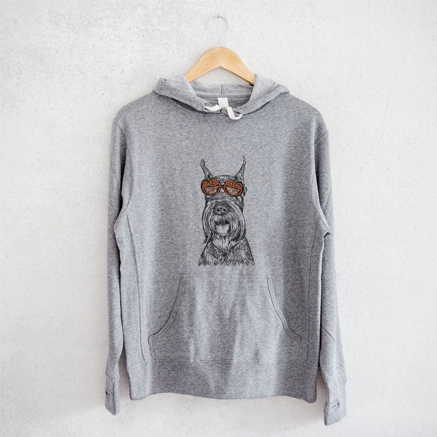 Hand-drawn sketch of Zuri the Giant Schnauzer wearing pumpkin glasses on a Grey pumpkin collection, on a hanger