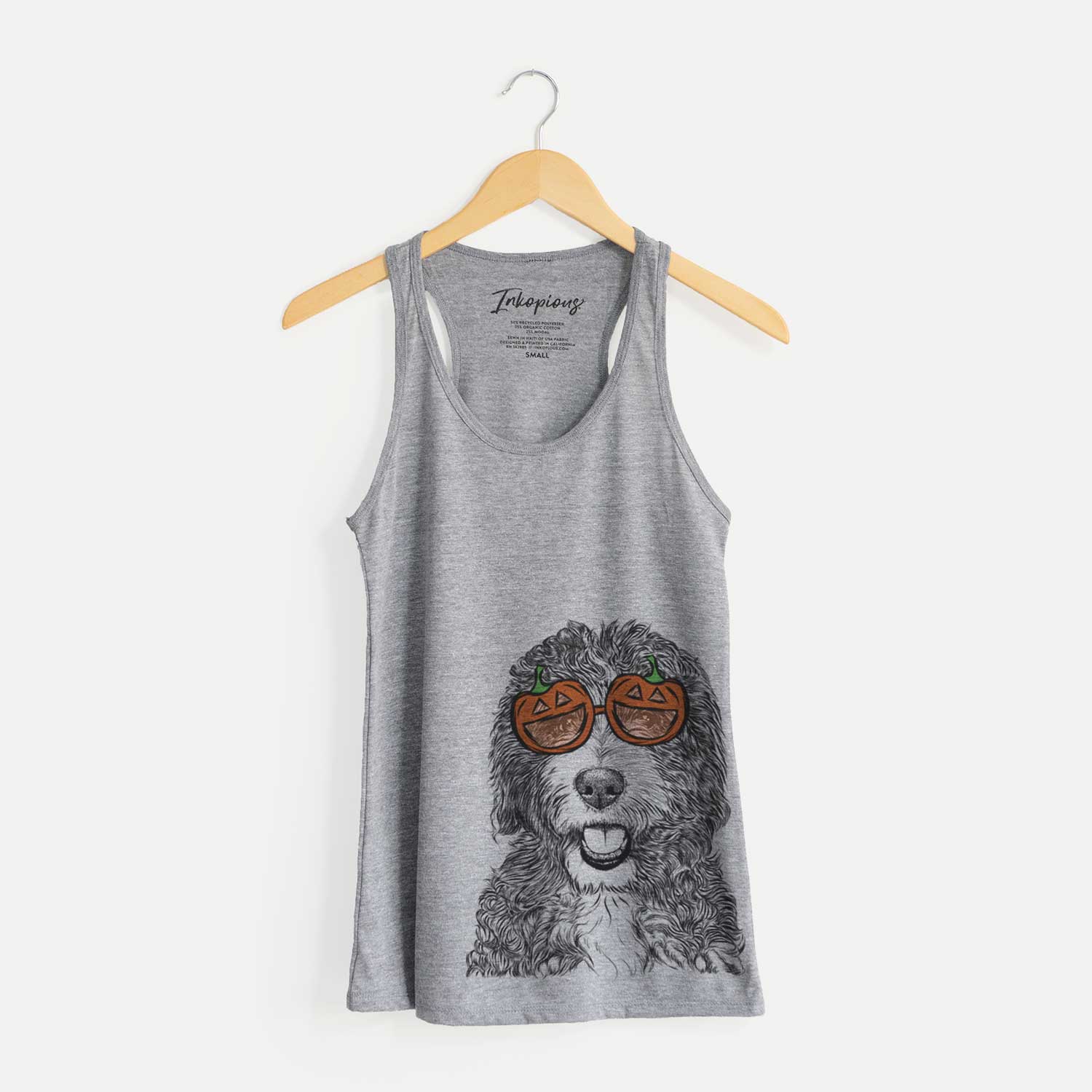 Hand-drawn sketch of Bash the Bernedoodle wearing pumpkin glasses on a Grey pumpkin collection