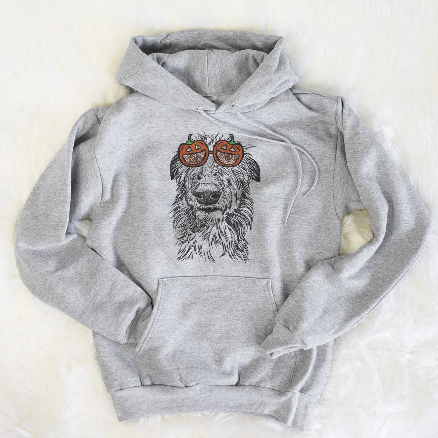 Hand-drawn sketch of Cleod the Scottish Deerhound wearing pumpkin glasses on a Grey pumpkin collection, flat lay