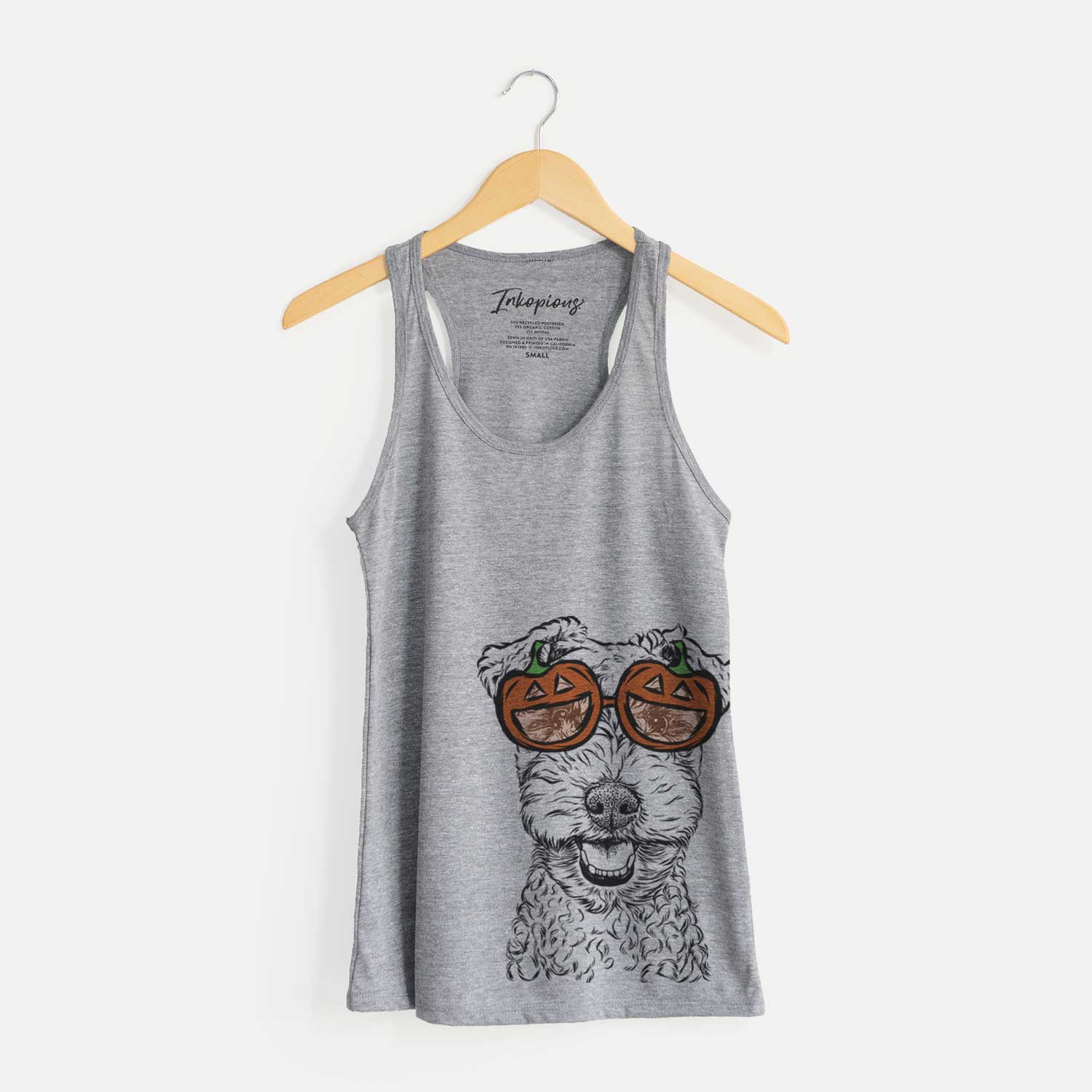 Hand-drawn sketch of Fintan the Irish Troodle wearing pumpkin glasses on a Grey pumpkin collection