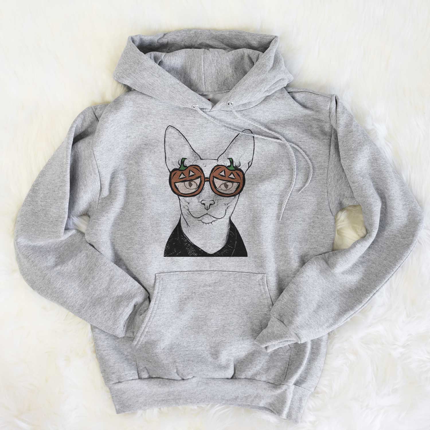 Hand-drawn sketch of Oliver Watson the Sphynx Cat wearing pumpkin glasses on a Grey pumpkin collection, flat lay