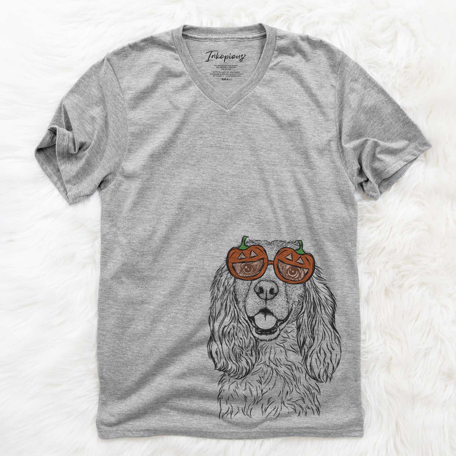 Hand-drawn sketch of Perry the Cockalier wearing pumpkin glasses on a Grey pumpkin collection