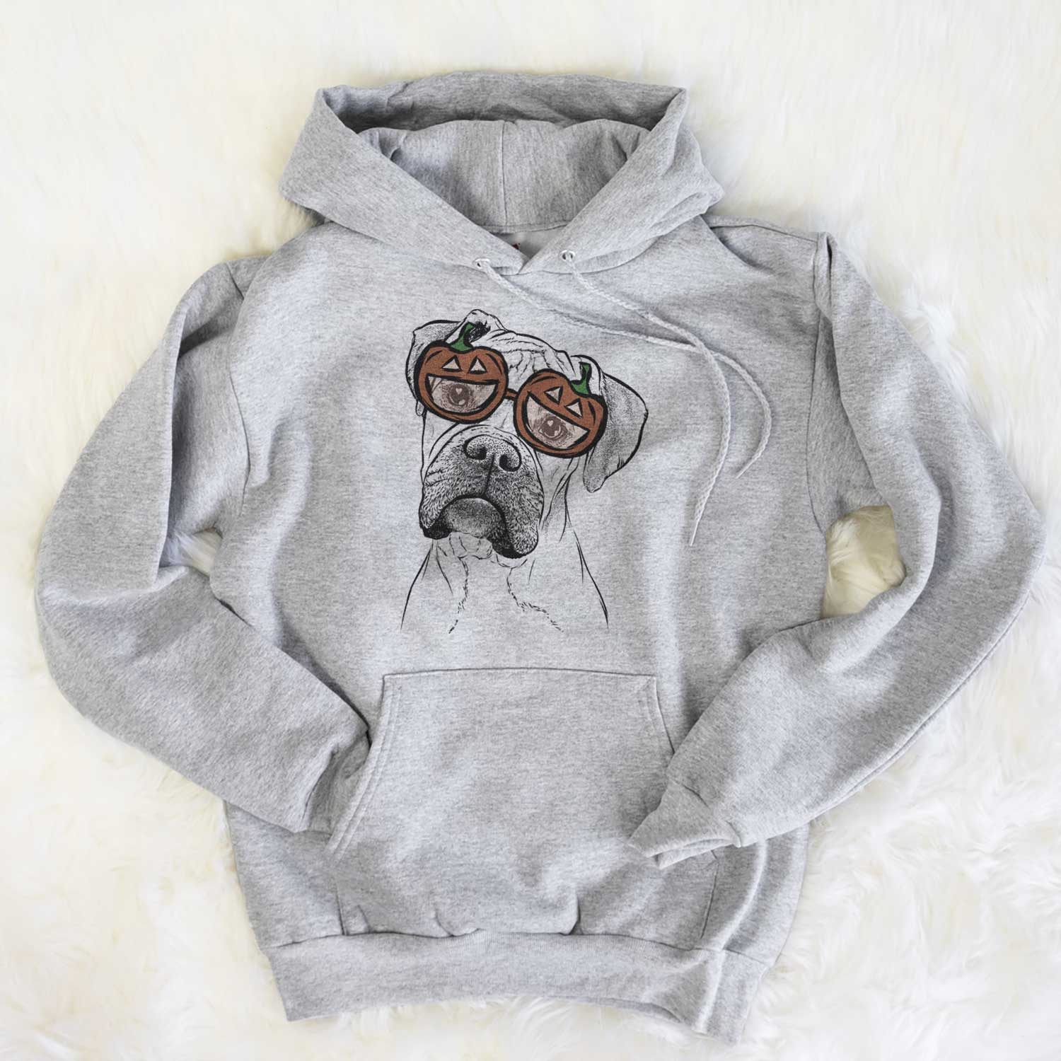 Hand-drawn sketch of Reuby the Boxer wearing pumpkin glasses on a Grey pumpkin collection, flat lay