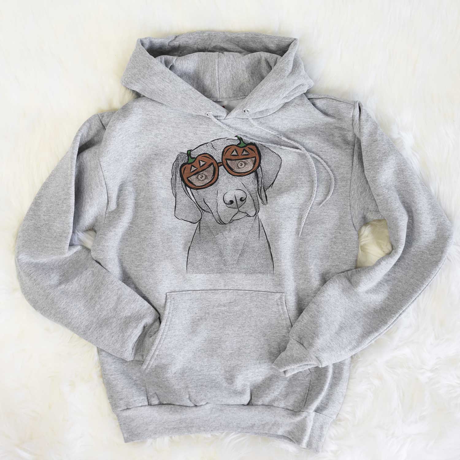 Hand-drawn sketch of Willow the Weizsla wearing pumpkin glasses on a Grey pumpkin collection, flat lay