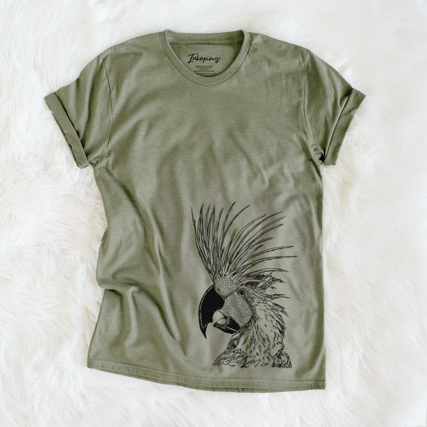 Side-profile sketch of a Palm Cockatoo on an Olive Unisex crewneck