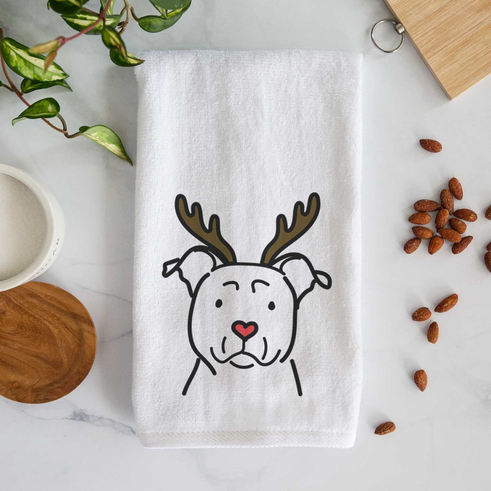 Minimalist line drawing of an American Staffordshire Terrier with reindeer antlers and a red nose on a decorative hand towel