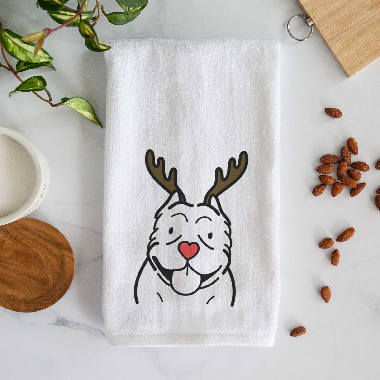 Minimalist line drawing of an American Bully with reindeer antlers and a red nose on a decorative hand towel