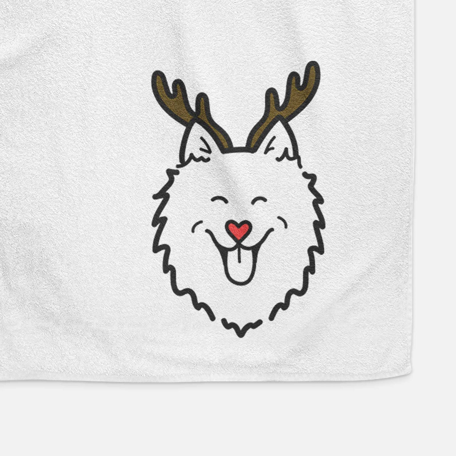 Minimalist line drawing of an American Eskimo with reindeer antlers and a red nose on a decorative hand towel