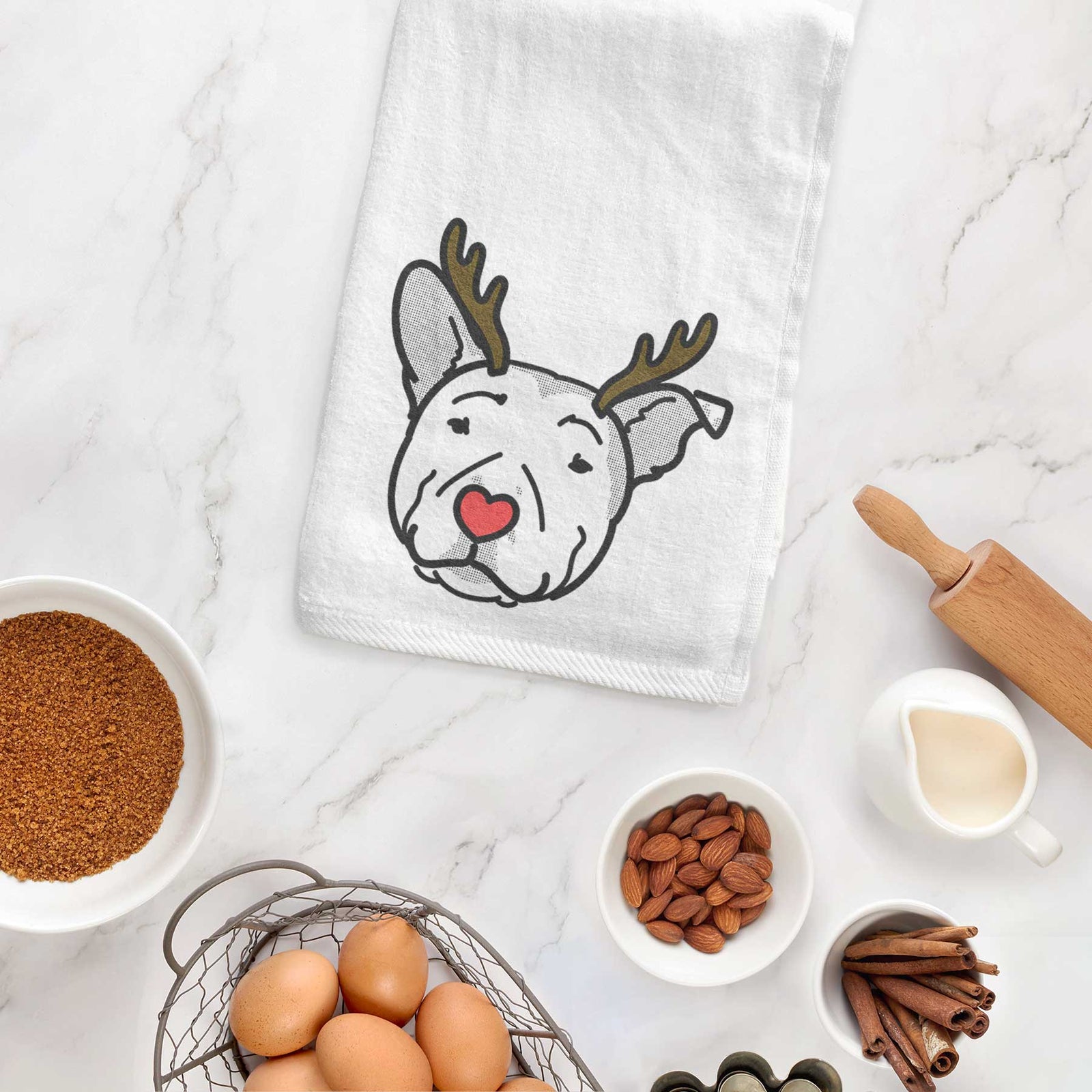 Minimalist line drawing of Archer the Pitbull with reindeer antlers and a red nose on a decorative hand towel