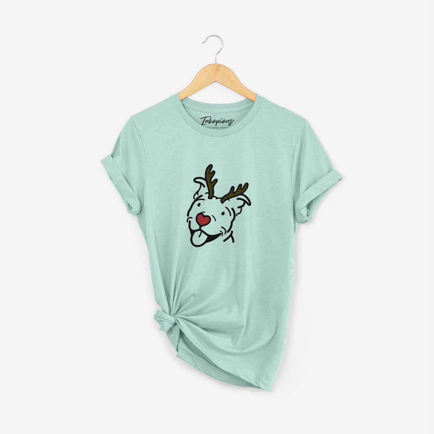 Minimalist line drawing of Arlo the Pitbull with reindeer antlers and a red nose on a Heather Sage Unisex crewneck