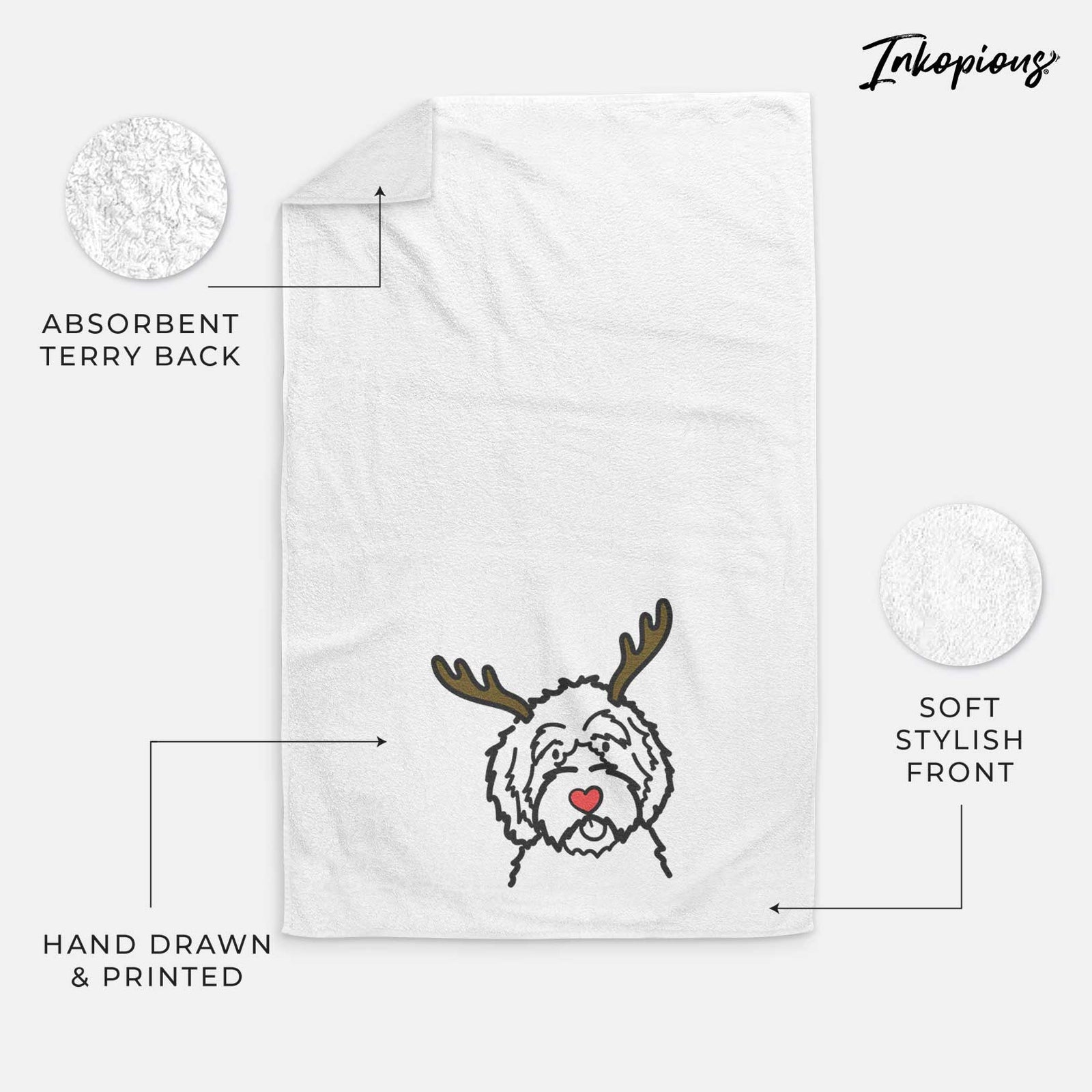 Minimalist line drawing of an Aussiedoodle with reindeer antlers and a red nose on a decorative hand towel