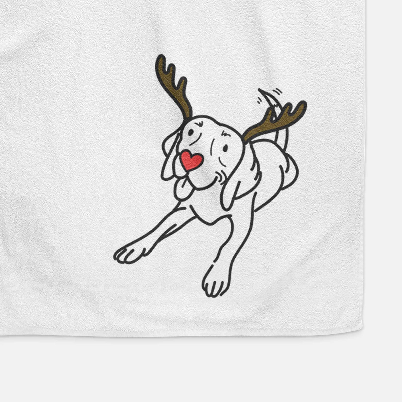 Minimalist line drawing of Bagel the Beagle with reindeer antlers and a red nose on a decorative hand towel