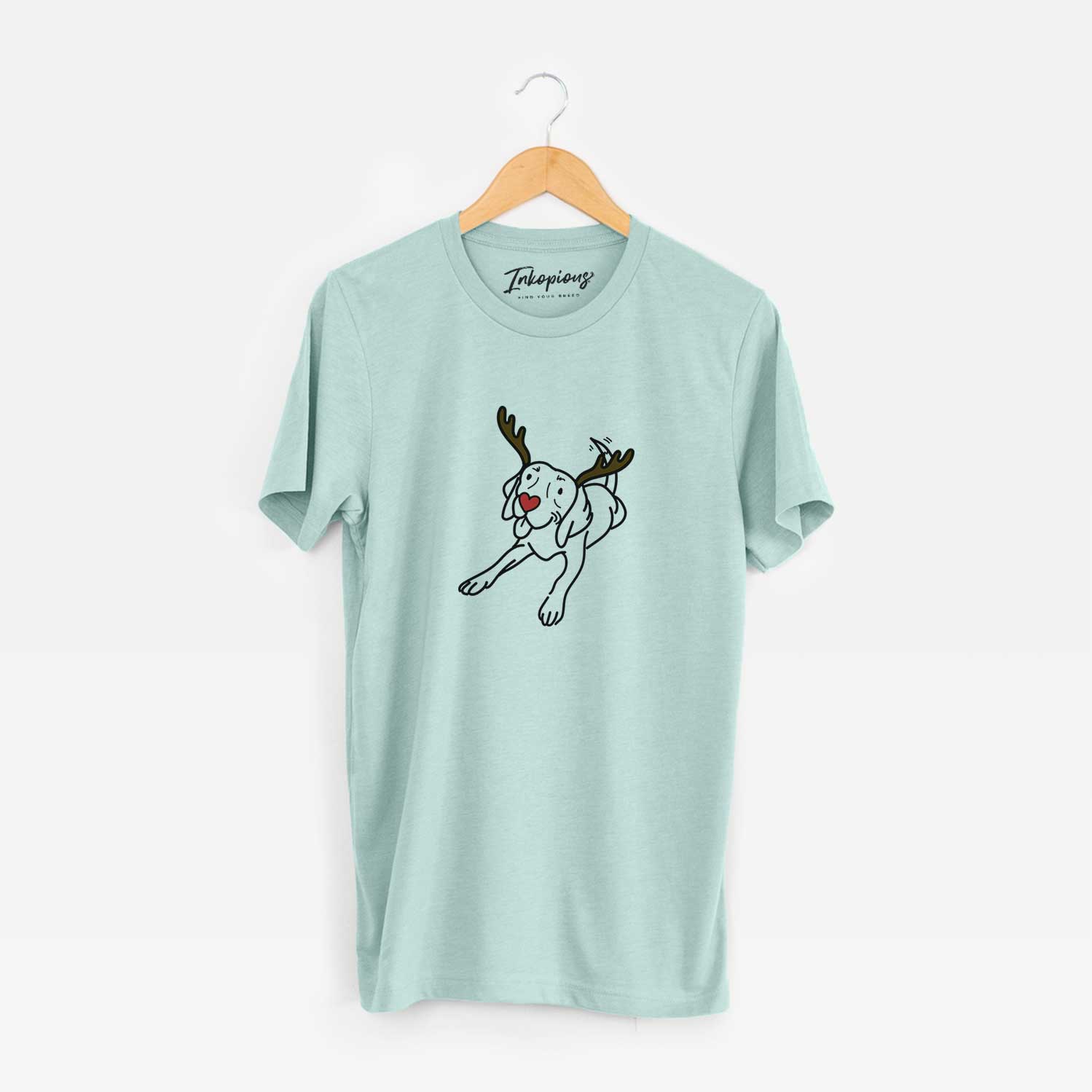 Minimalist line drawing of Bagel the Beagle with reindeer antlers and a red nose on a Heather Sage Unisex crewneck