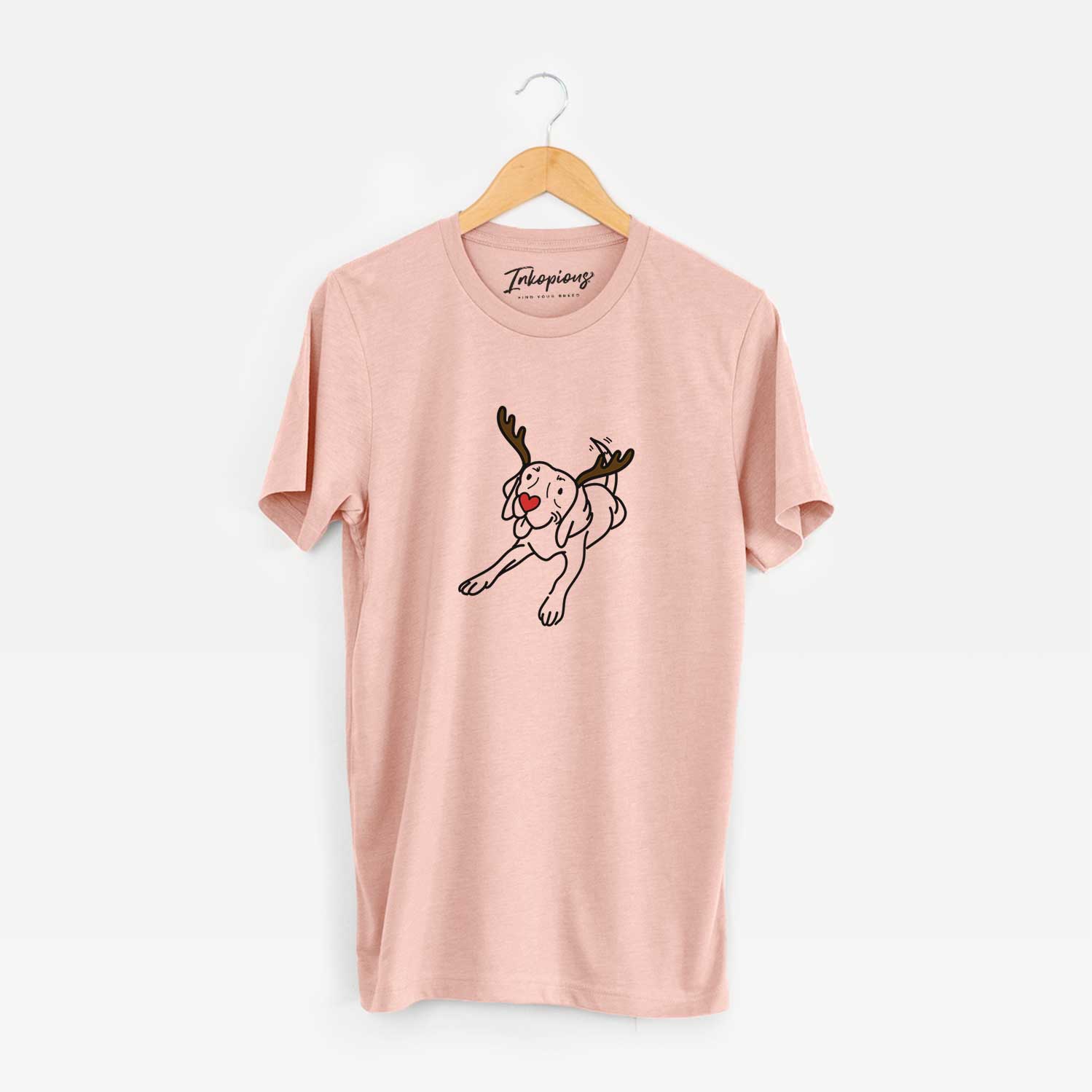 Minimalist line drawing of Bagel the Beagle with reindeer antlers and a red nose on a Peach Unisex crewneck