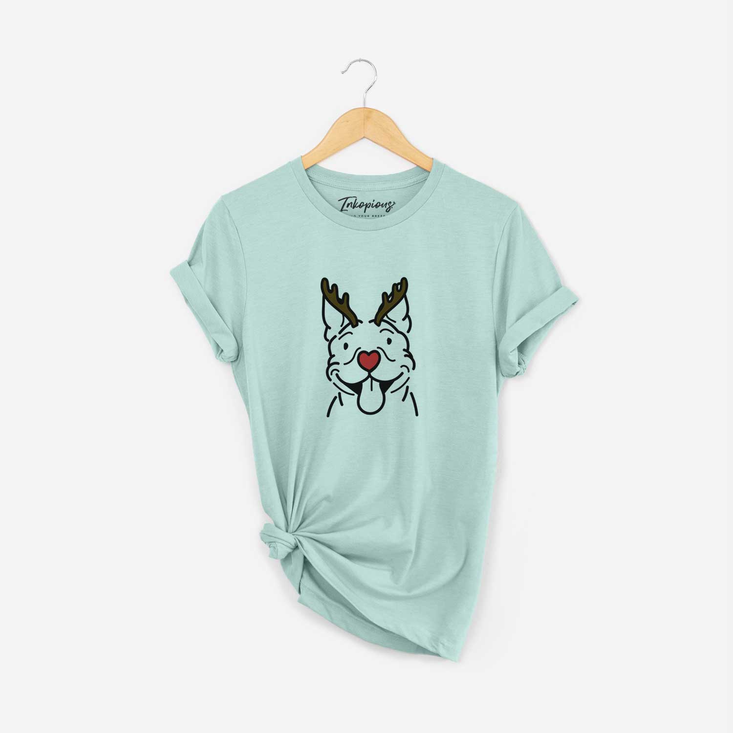 Minimalist line drawing of Basil the Pitbull with reindeer antlers and a red nose on a Heather Sage Unisex crewneck