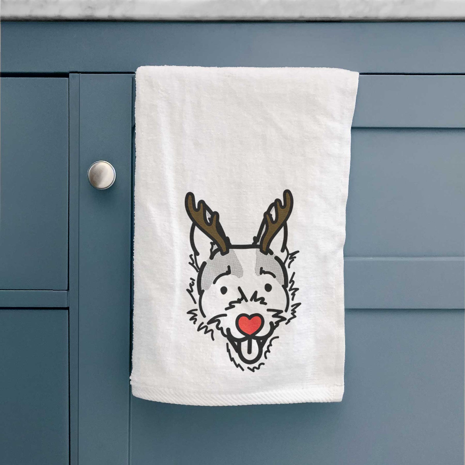 Minimalist line drawing of Baxter the Jack Russell Terrier with reindeer antlers and a red nose on a decorative hand towel