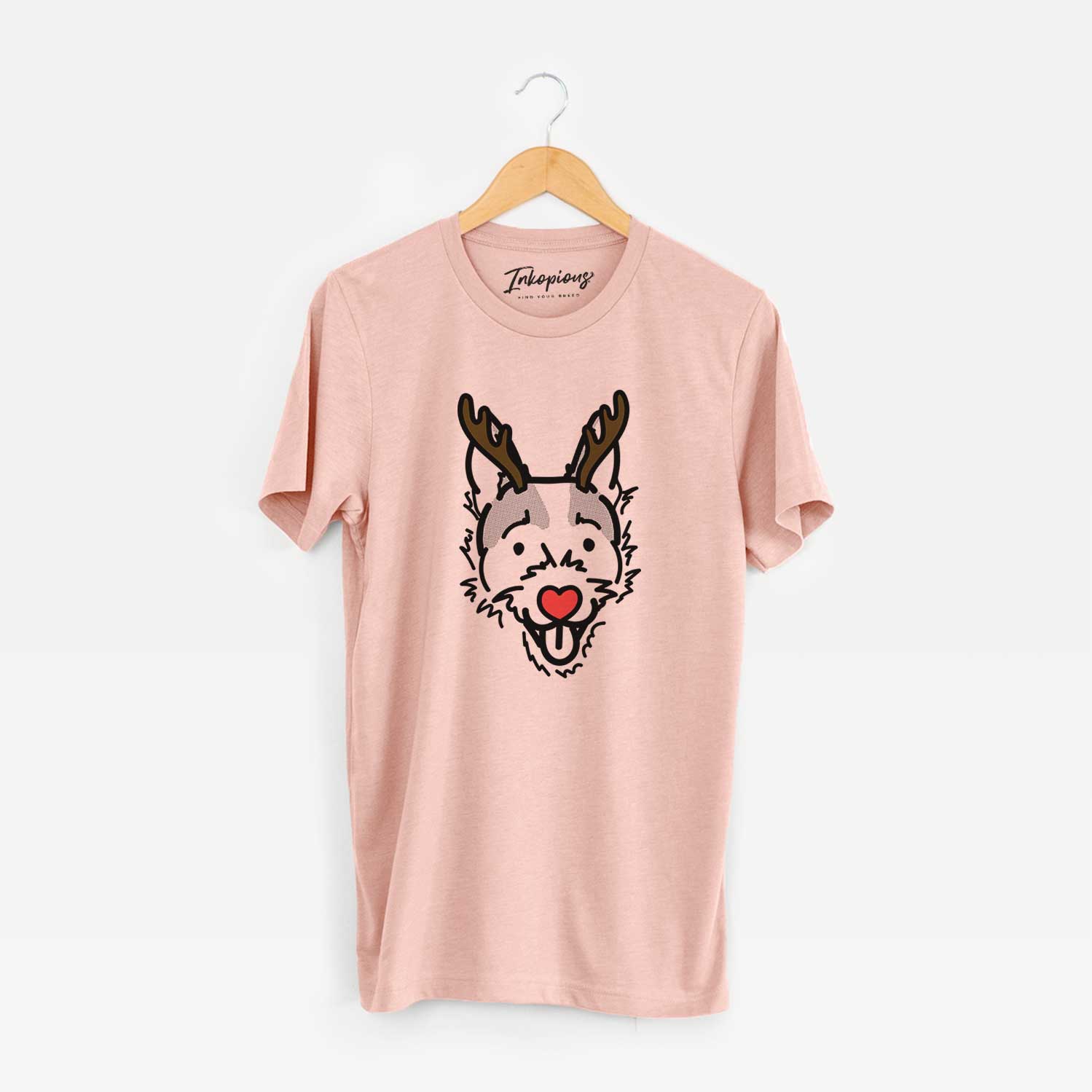 Minimalist line drawing of Baxter the Jack Russell Terrier with reindeer antlers and a red nose on a Peach Unisex crewneck