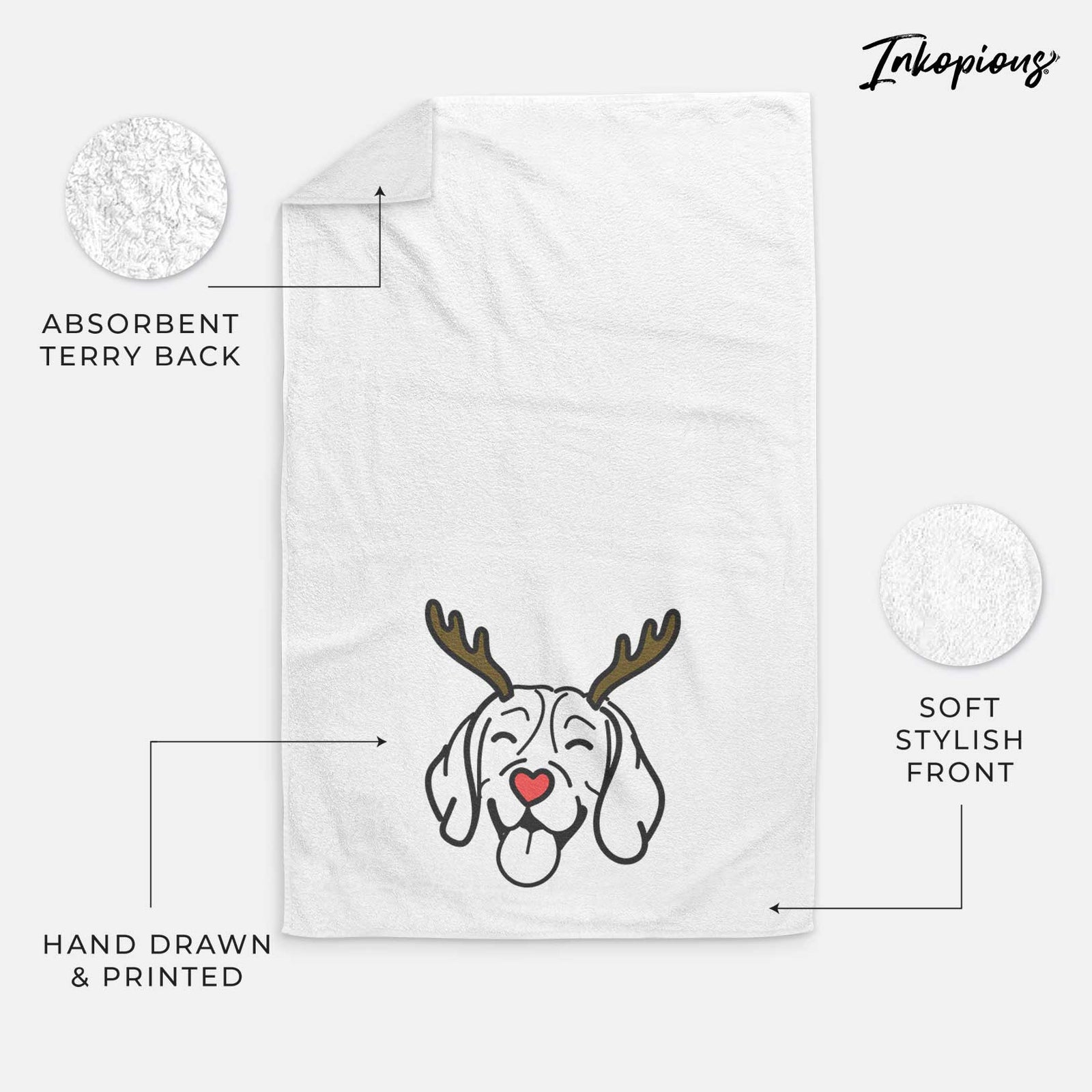 Minimalist line drawing of a Beagle with reindeer antlers and a red nose on a decorative hand towel