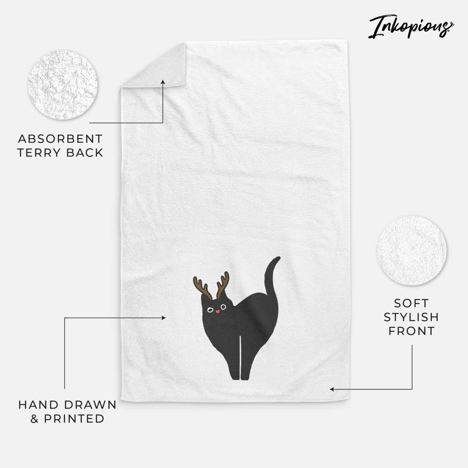 Minimalist line drawing of Bella the Black Cat with reindeer antlers and a red nose on a decorative hand towel