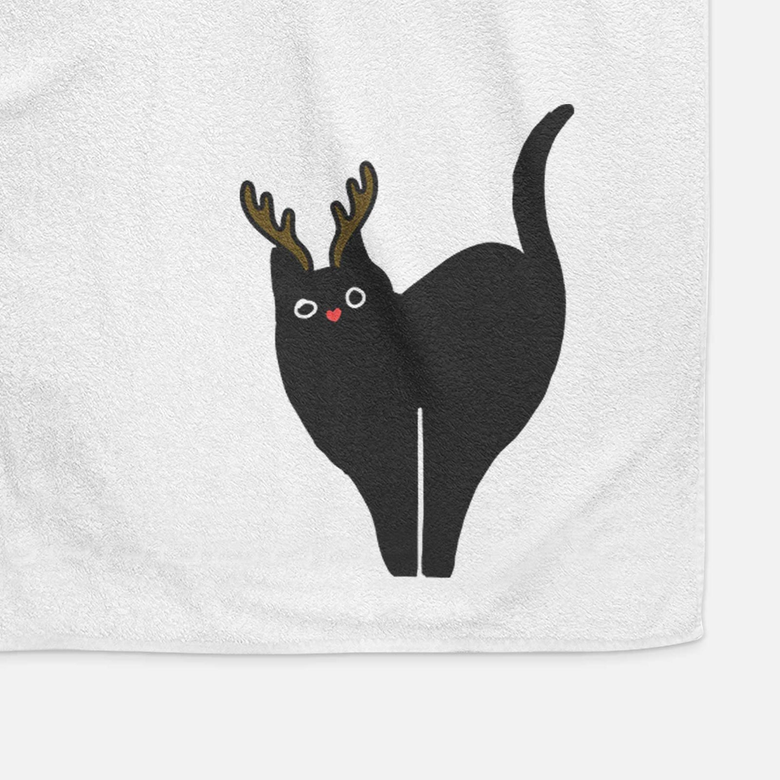 Minimalist line drawing of Bella the Black Cat with reindeer antlers and a red nose on a decorative hand towel