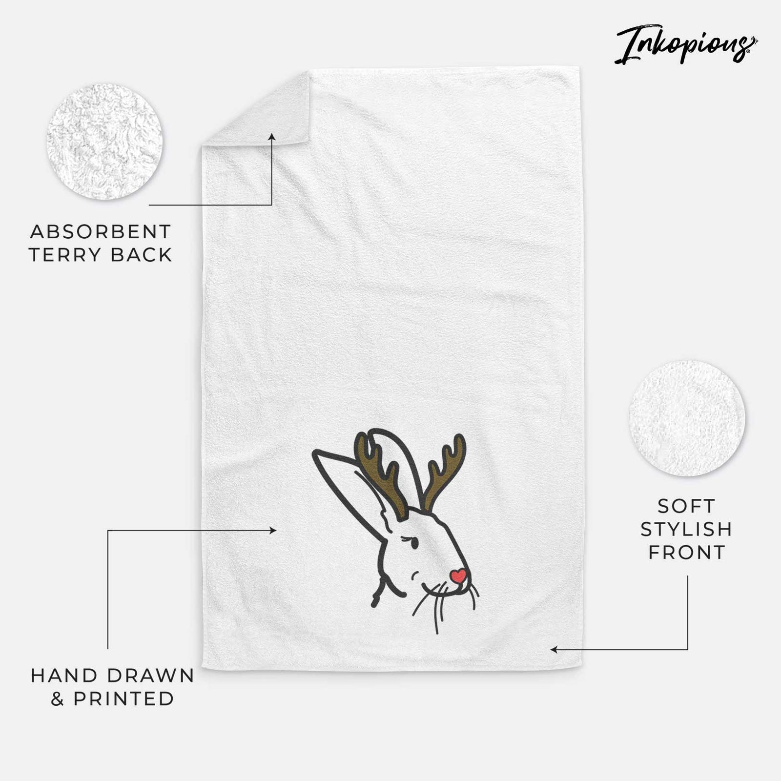 Minimalist line drawing of Betsy the Rex Rabbit with reindeer antlers and a red nose on a decorative hand towel