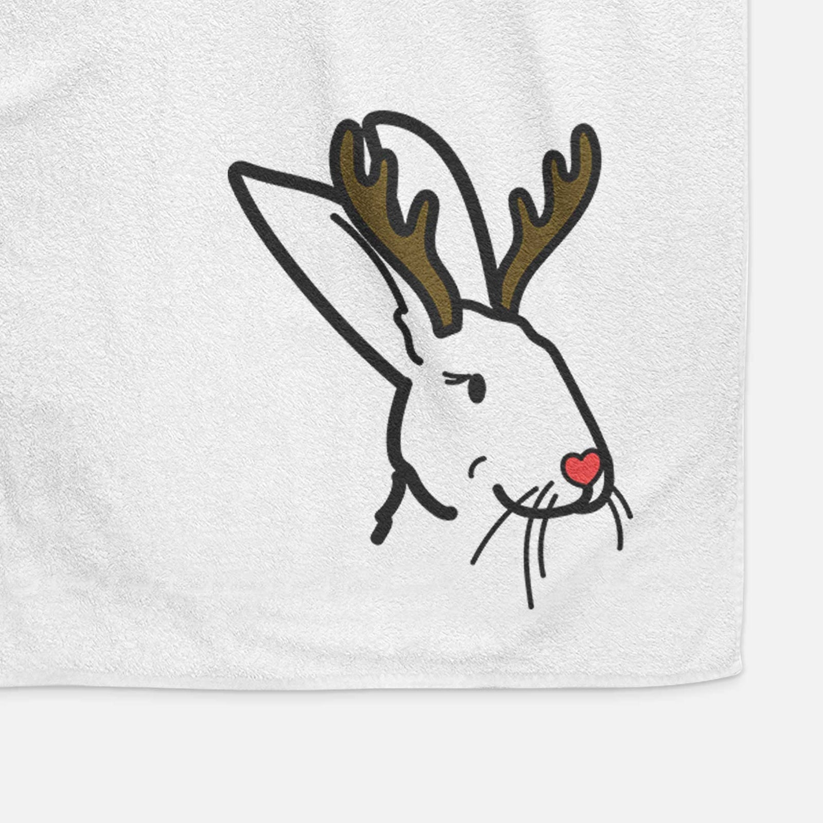 Minimalist line drawing of Betsy the Rex Rabbit with reindeer antlers and a red nose on a decorative hand towel