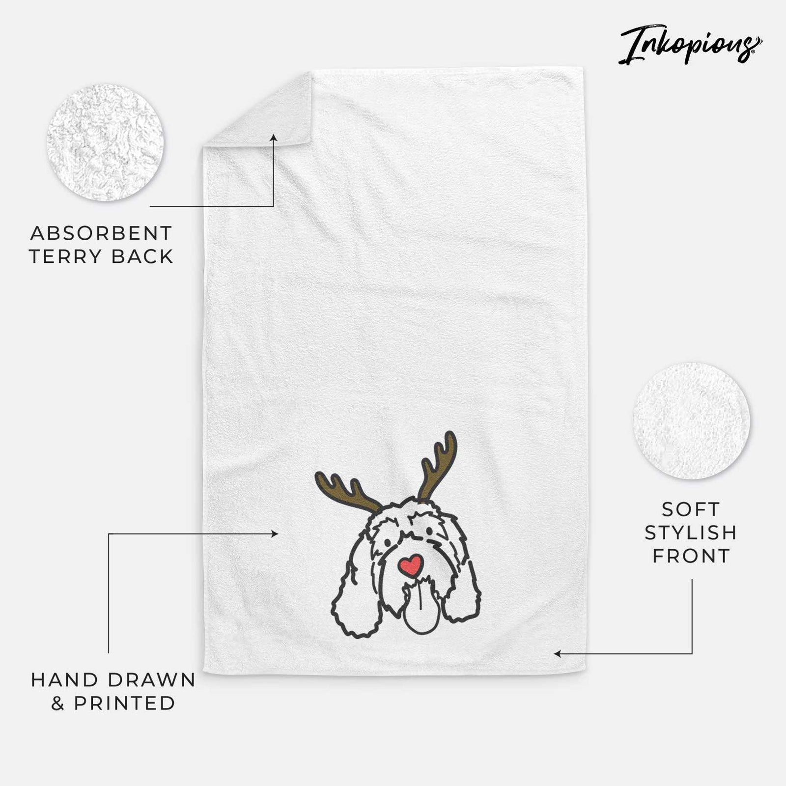 Minimalist line drawing of Bo the Portguese Water Dog with reindeer antlers and a red nose on a decorative hand towel